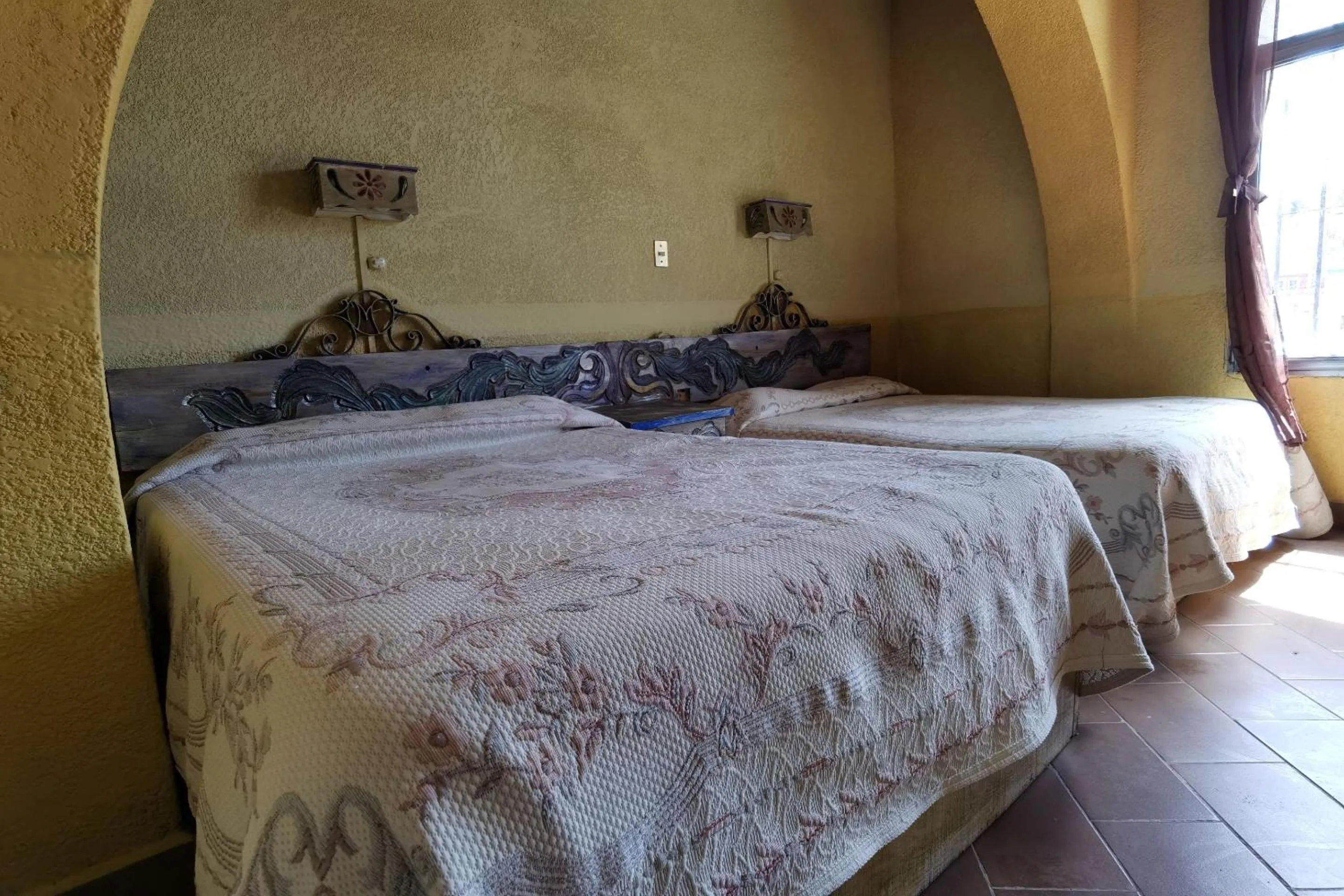 Bedroom in CAPITAL O Meson De La Fragua