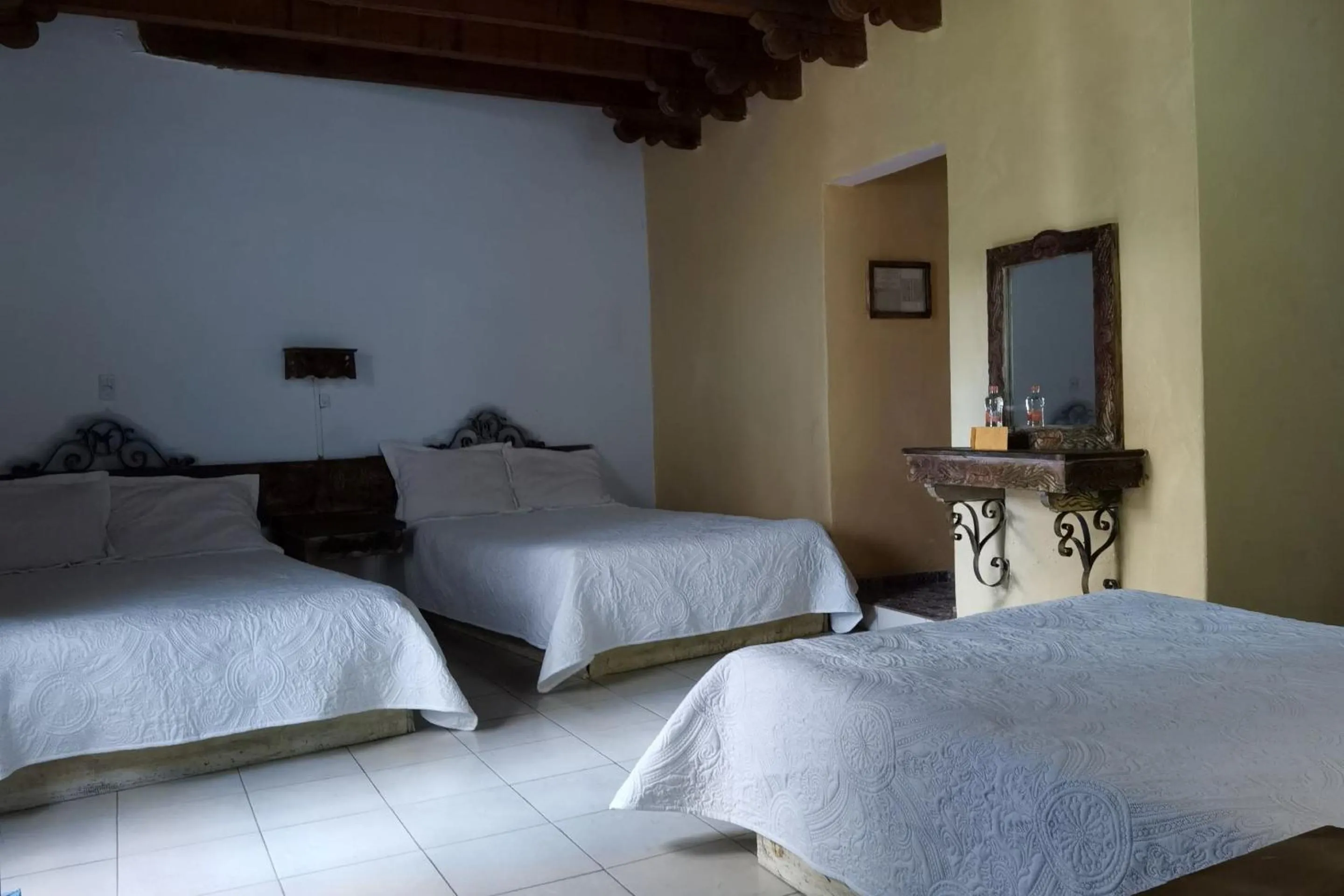 Bedroom in CAPITAL O Meson De La Fragua