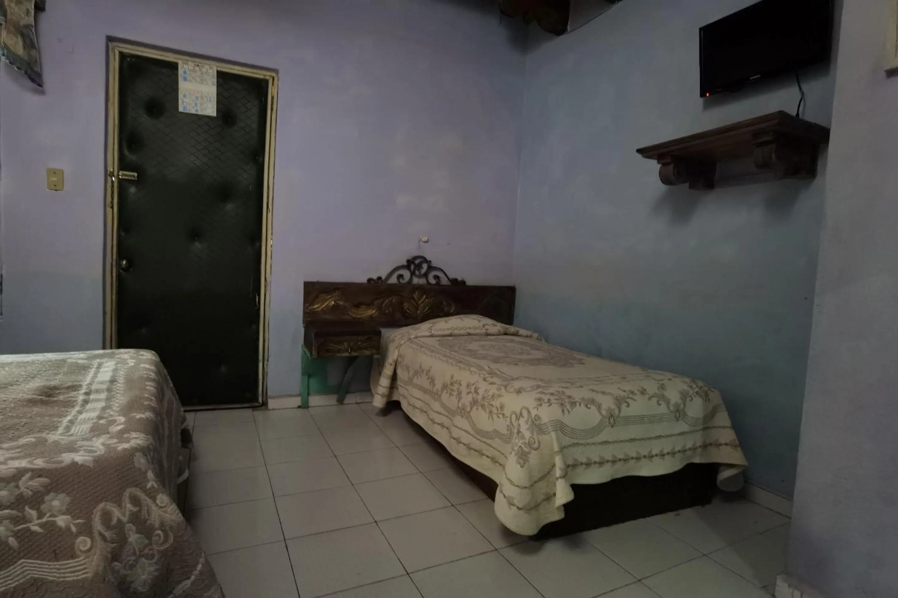 Bedroom in CAPITAL O Meson De La Fragua