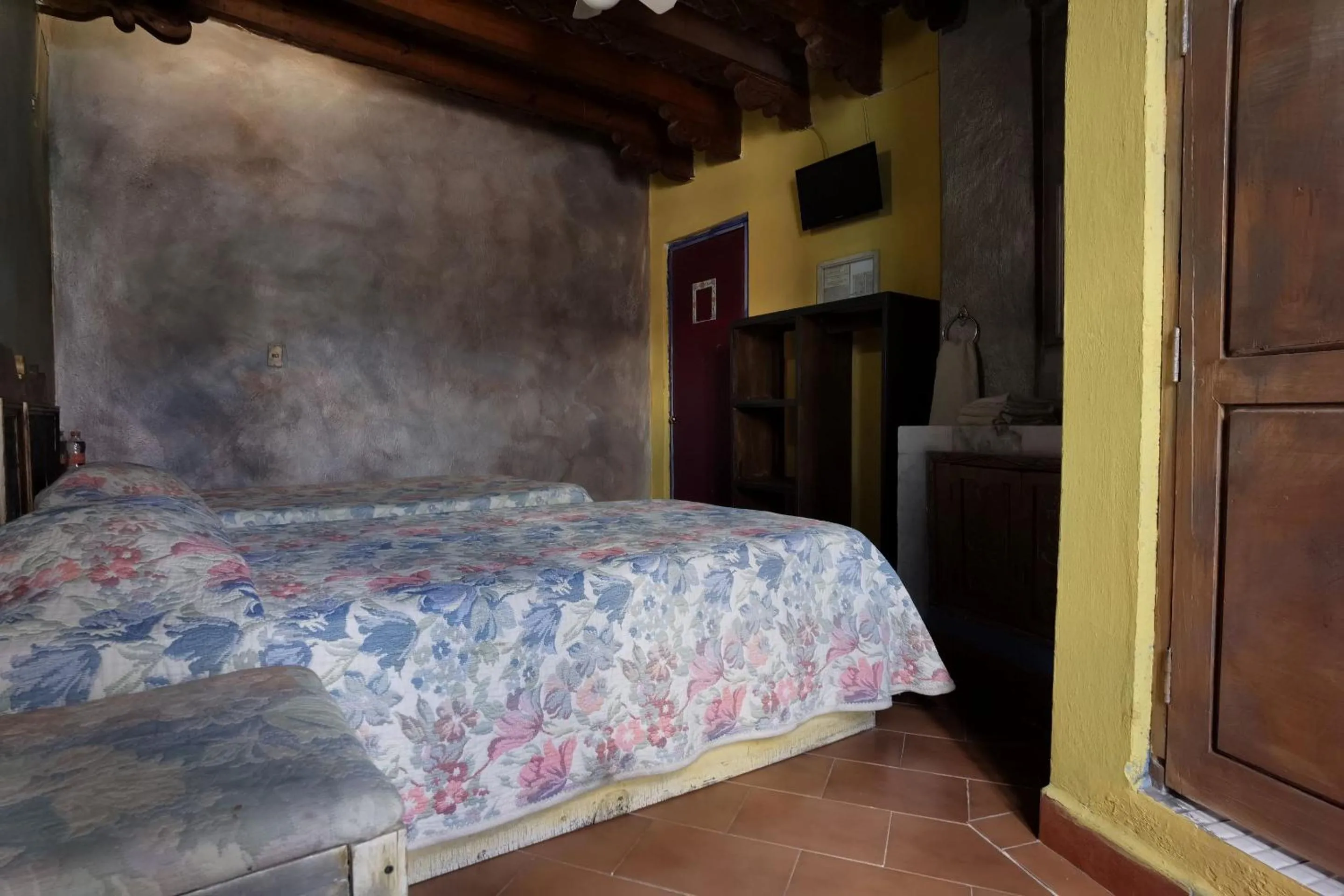 Bedroom in CAPITAL O Meson De La Fragua