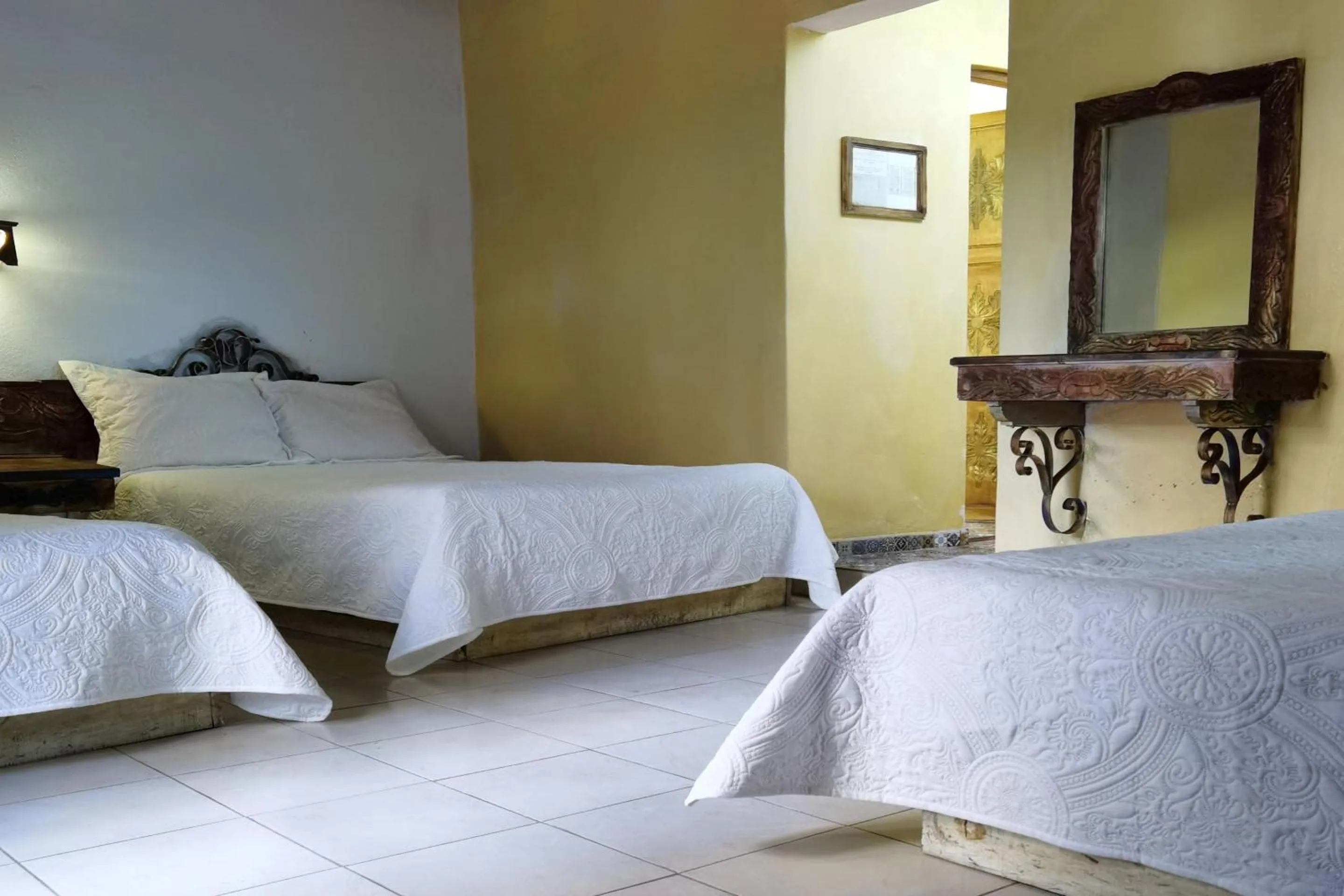 Bedroom in CAPITAL O Meson De La Fragua