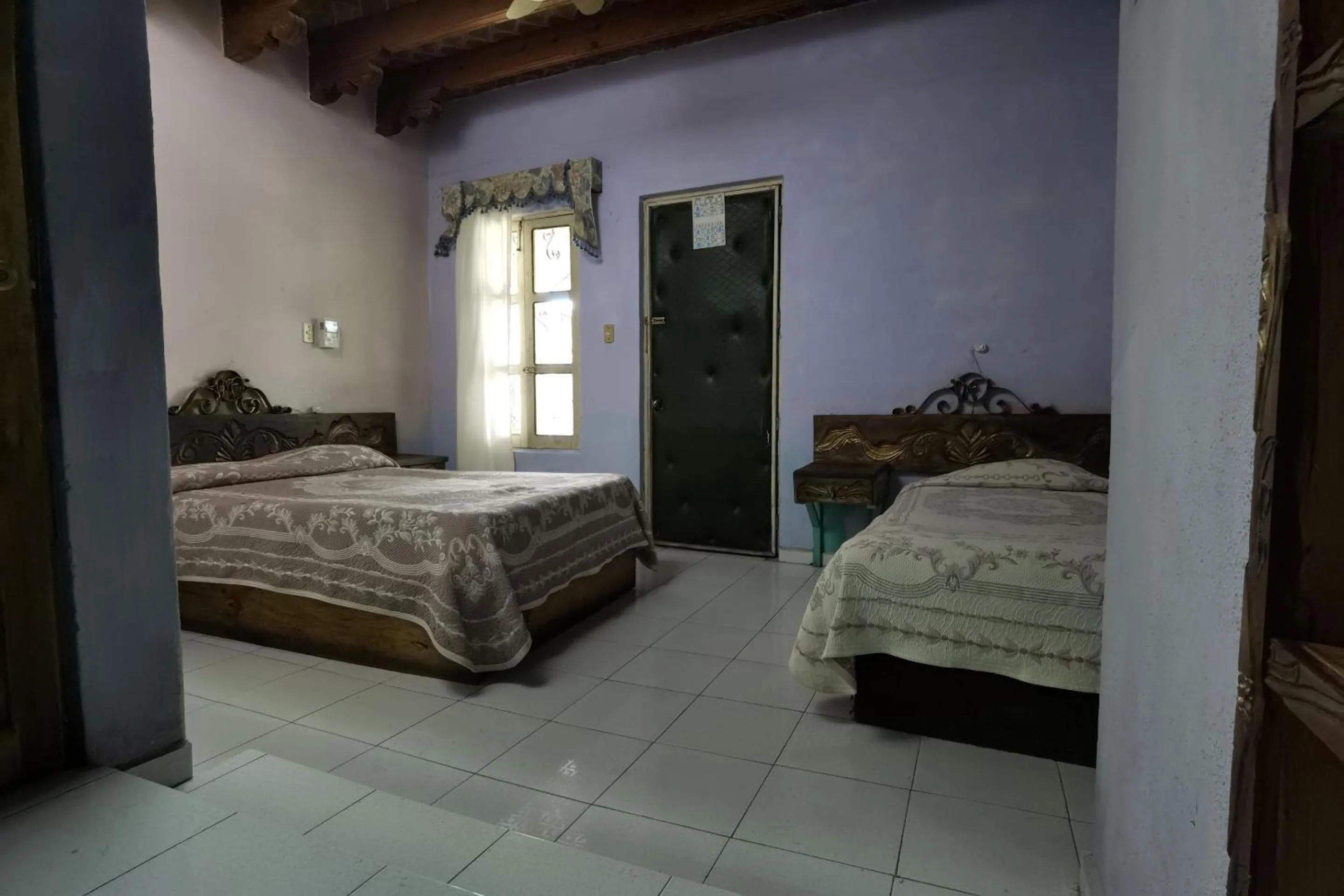 Bedroom in CAPITAL O Meson De La Fragua