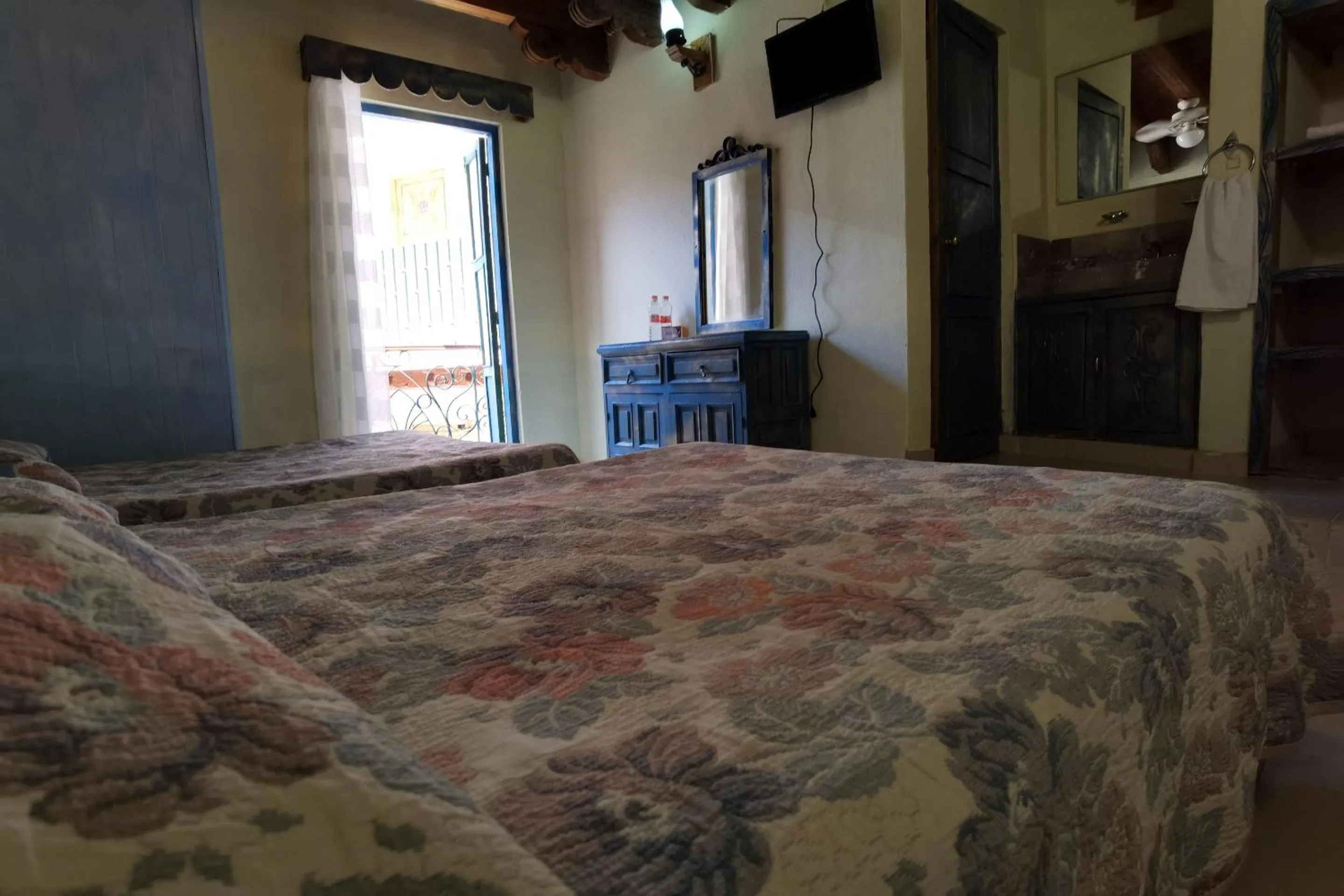 Bedroom in CAPITAL O Meson De La Fragua