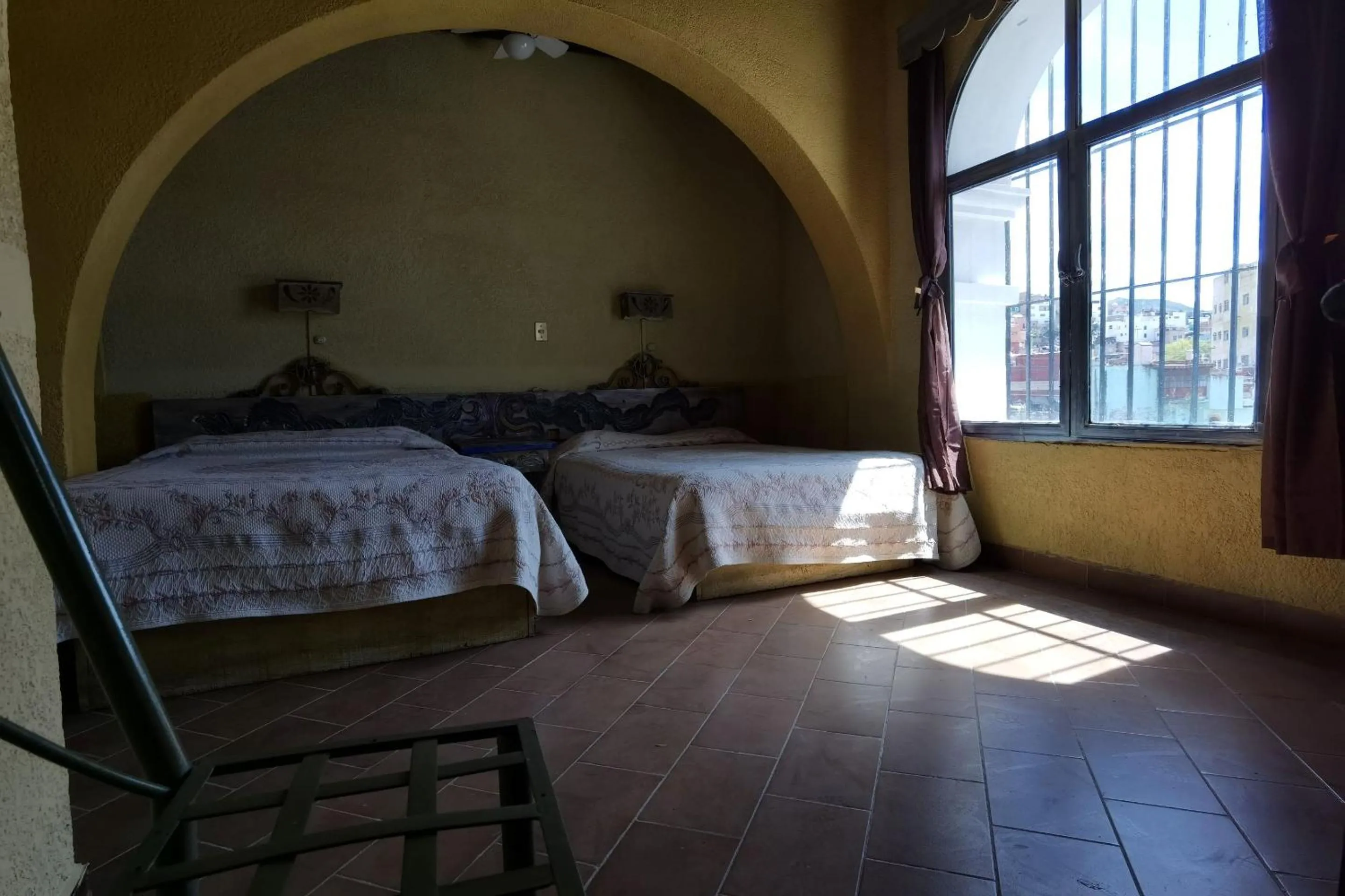 Bedroom in CAPITAL O Meson De La Fragua