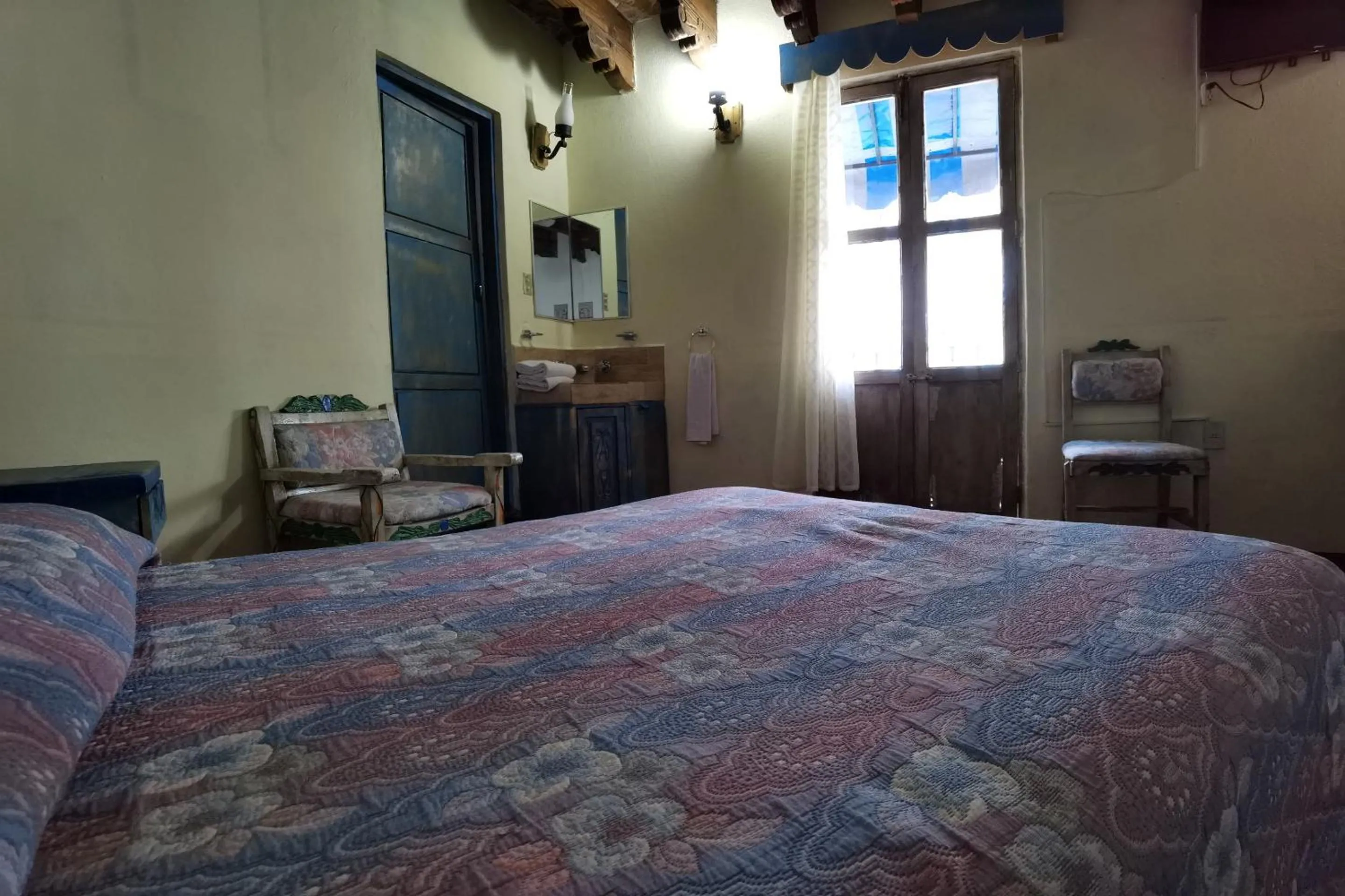 Bedroom in CAPITAL O Meson De La Fragua