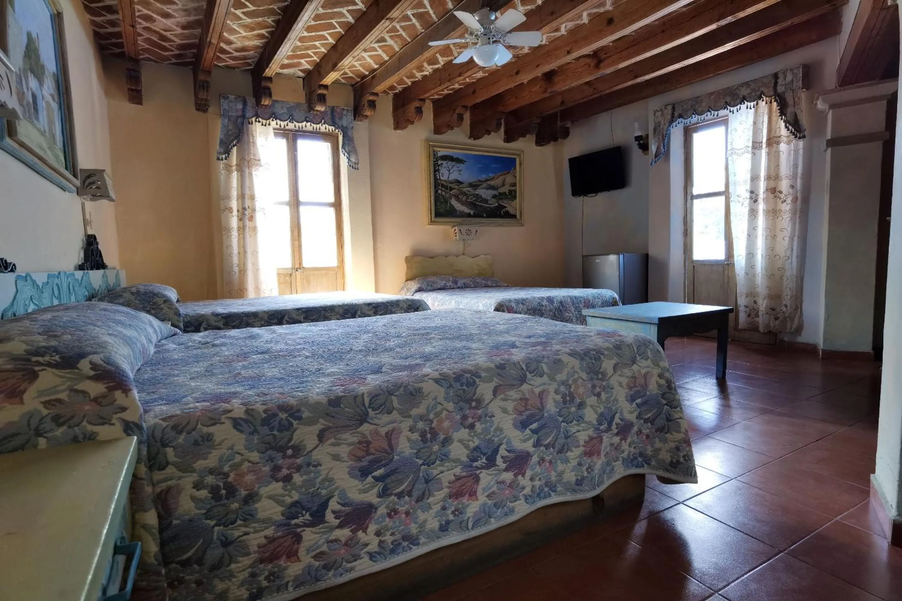 Bedroom in CAPITAL O Meson De La Fragua