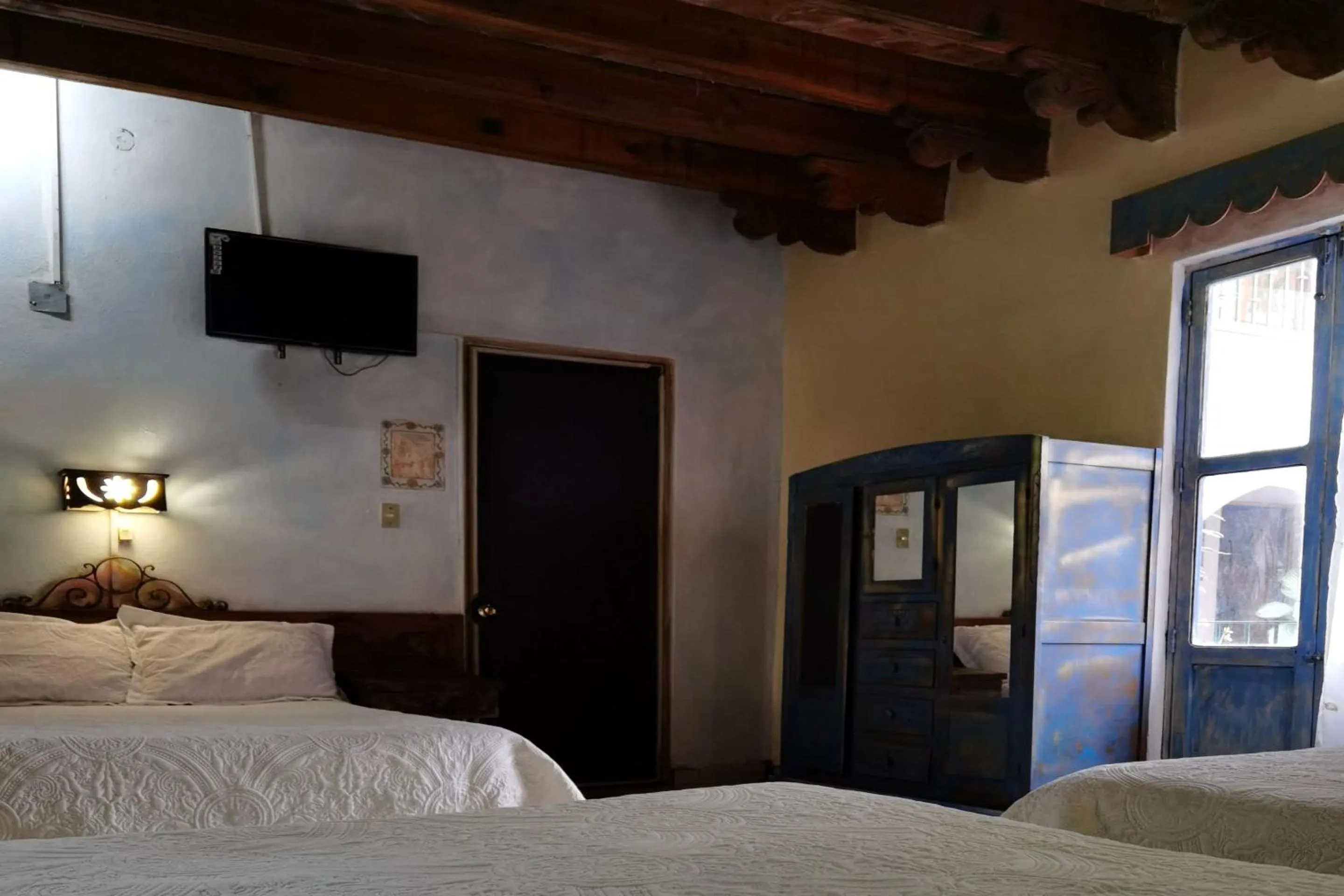 Bedroom in CAPITAL O Meson De La Fragua