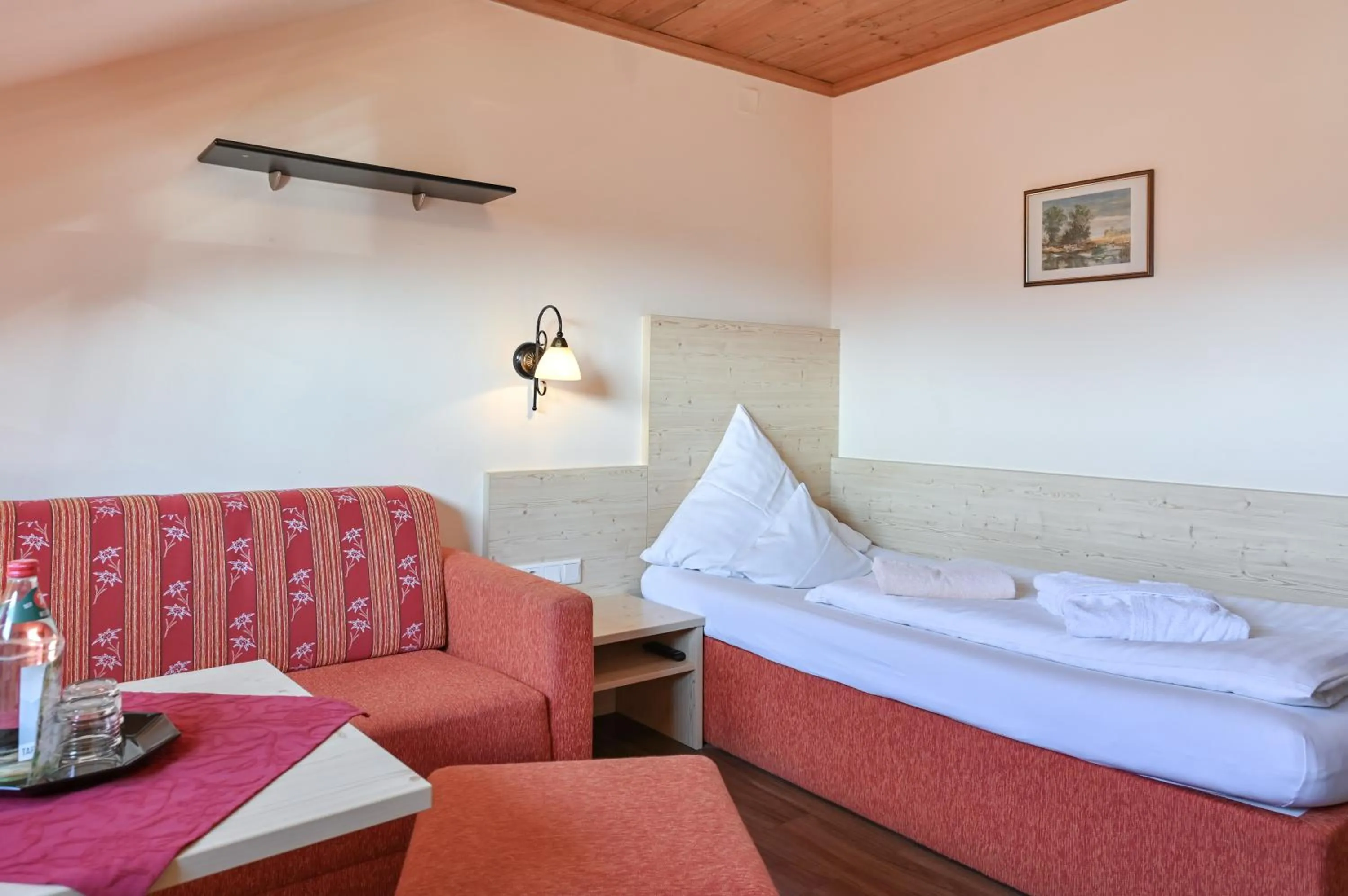 Seating area, Bed in Hotel Weinbauer