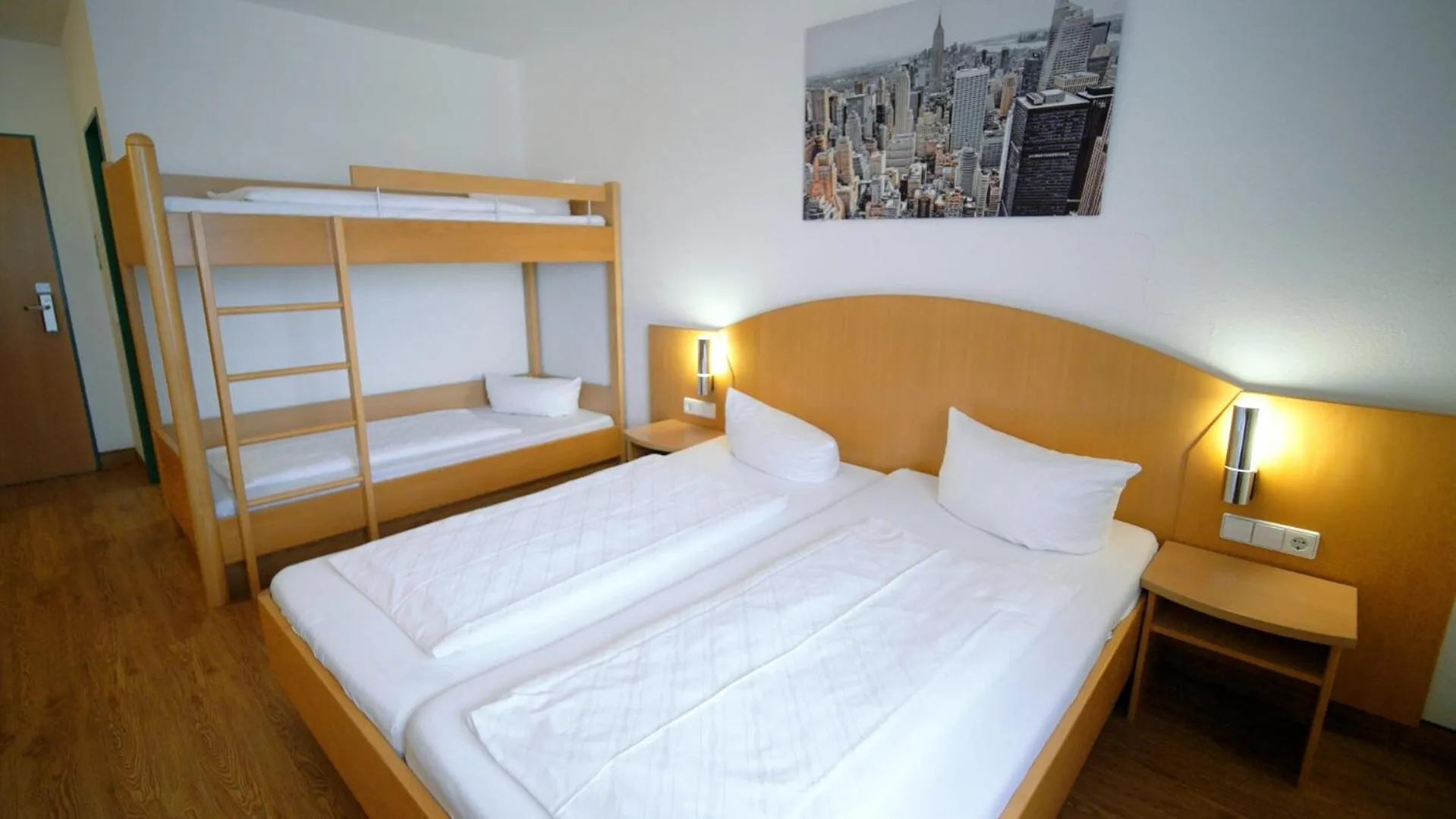 Photo of the whole room, Bed in Hotel SunParc - SHUTTLE zum Europa-Park Rust 4km & Rulantica 2km