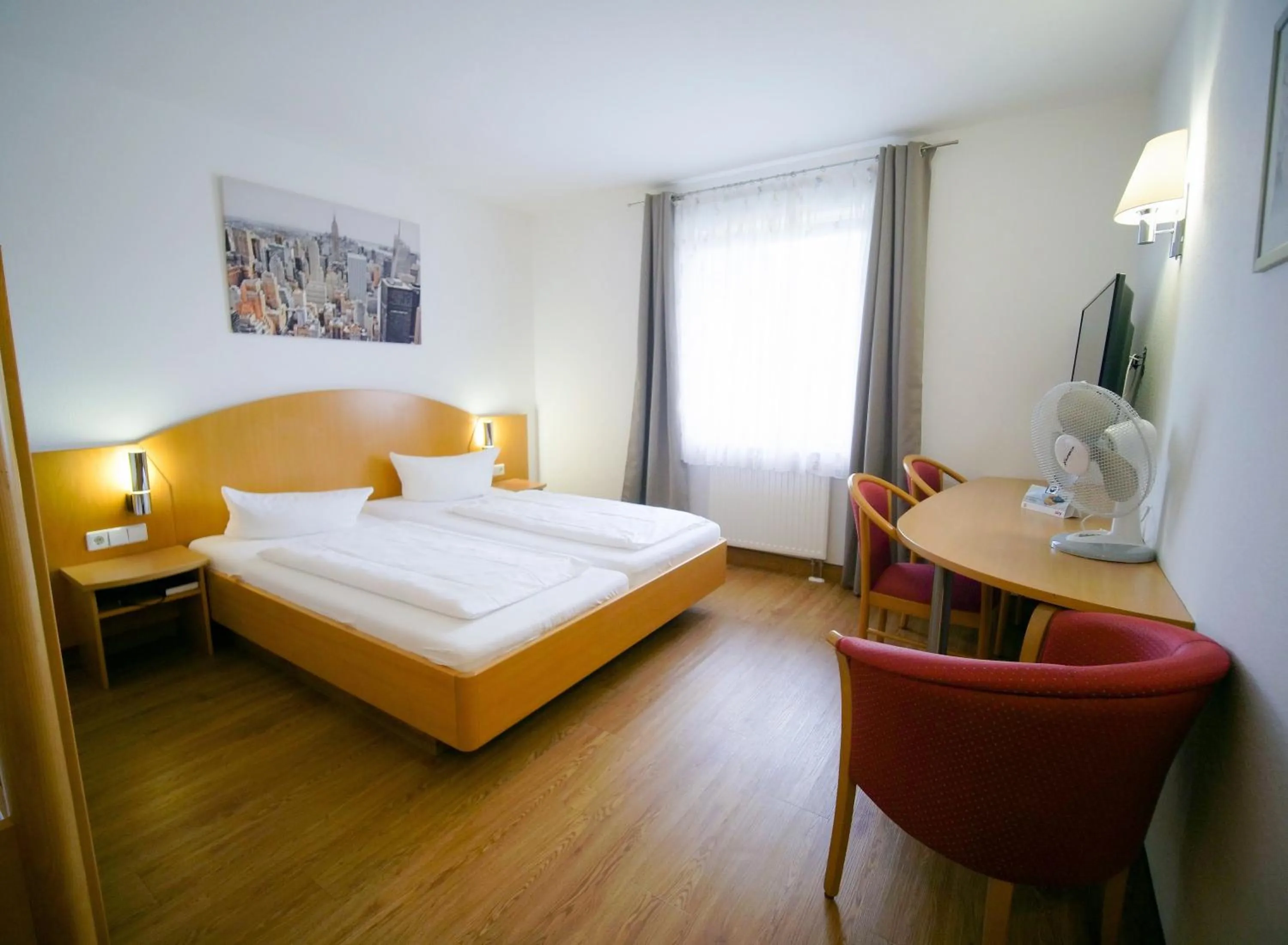 Photo of the whole room, Bed in Hotel SunParc - SHUTTLE zum Europa-Park Rust 4km & Rulantica 2km