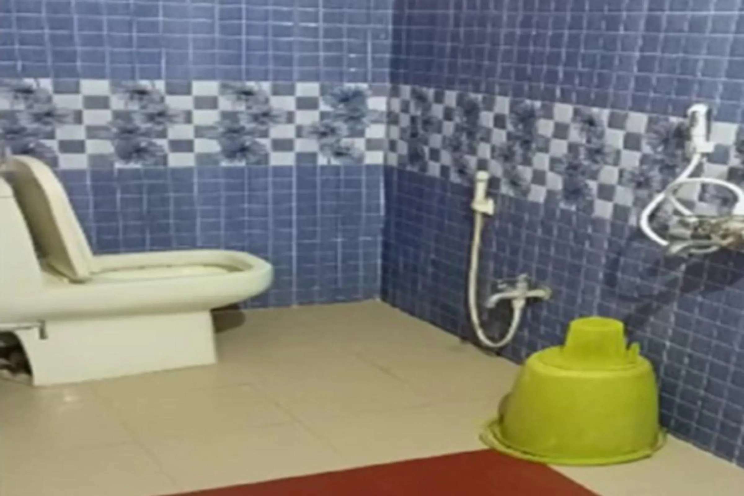 Bathroom in Galaxy Inn by StayApart