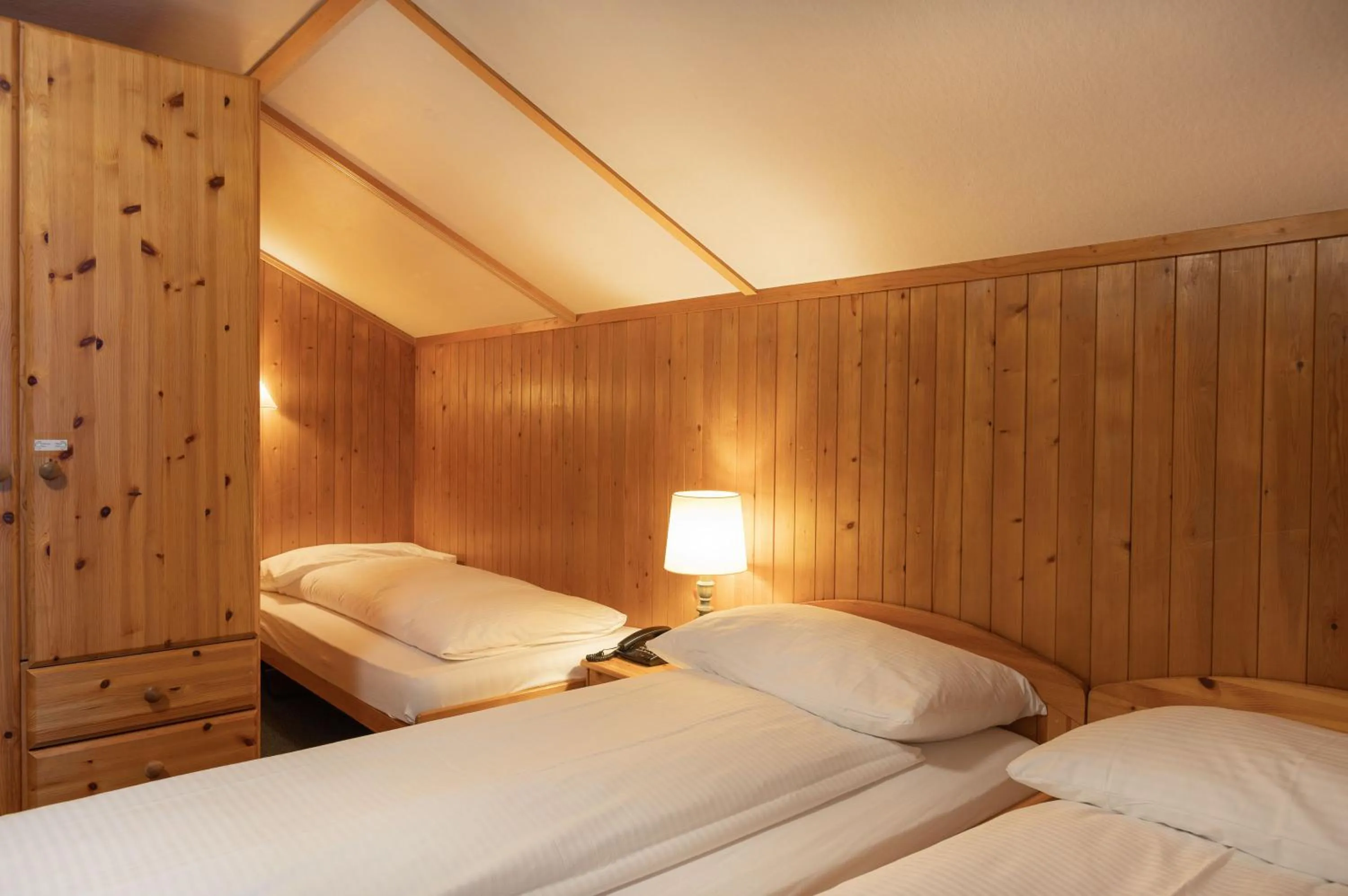 Bedroom, Bed in Jungfrau Lodge, Swiss Mountain Hotel