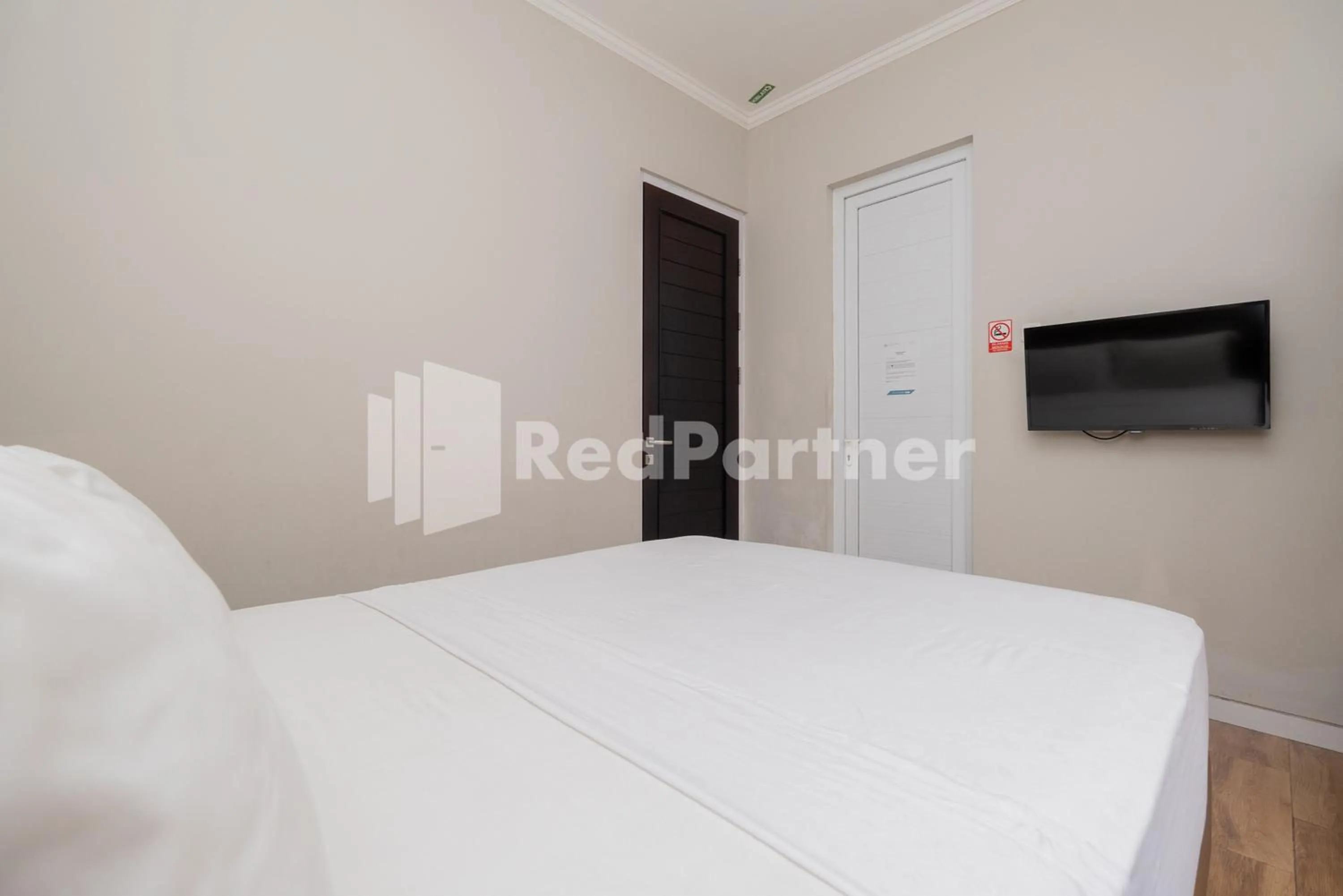 Bed in Palm Eight Mitra RedDoorz