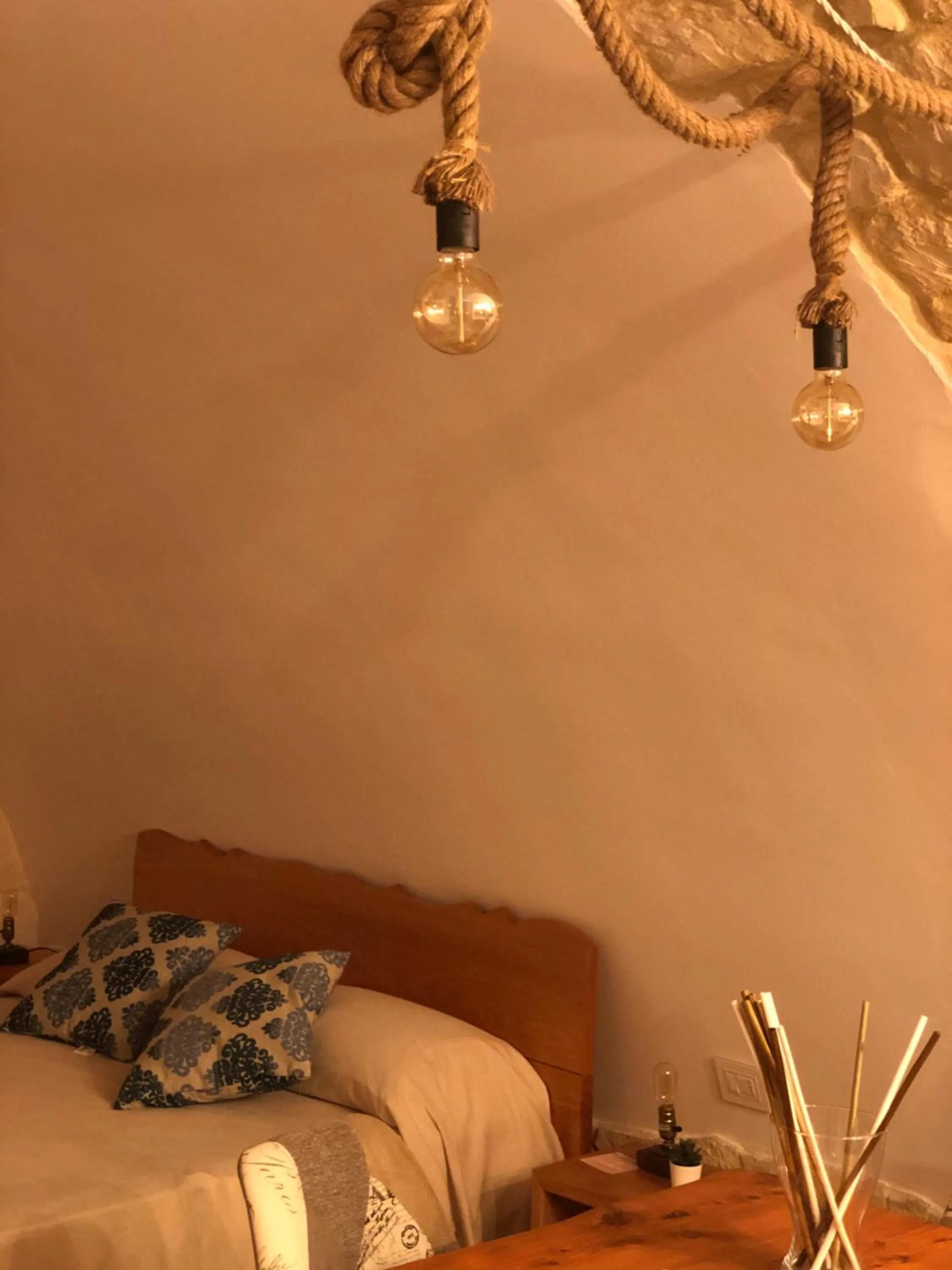 Bed in Il Galletto Viola, luxury room & suite