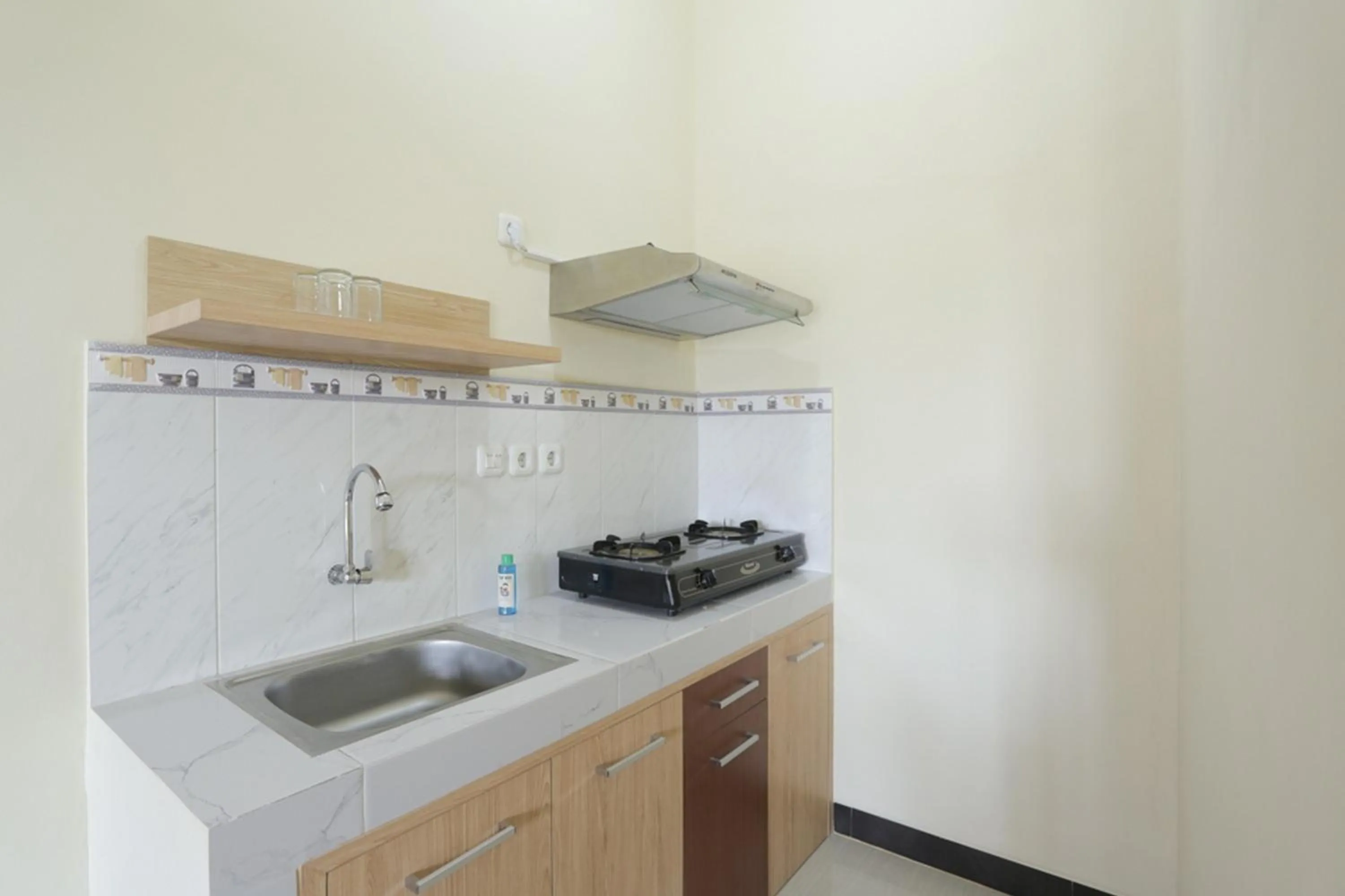 Kitchen or kitchenette in IDR Green Guest House Syariah Mitra RedDoorz