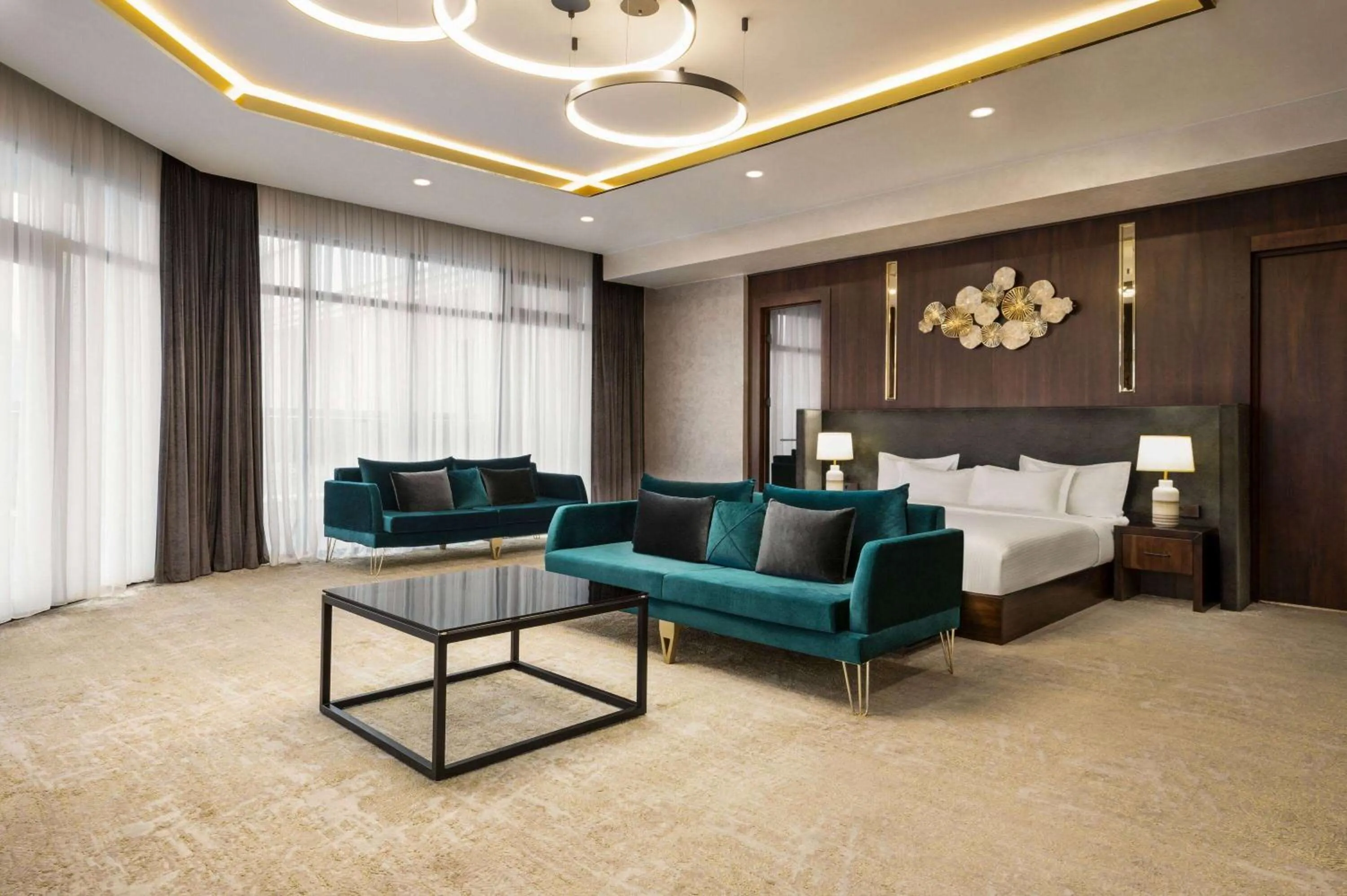 Bed, Seating Area in Regal Stay Hotel by HotelPro Group