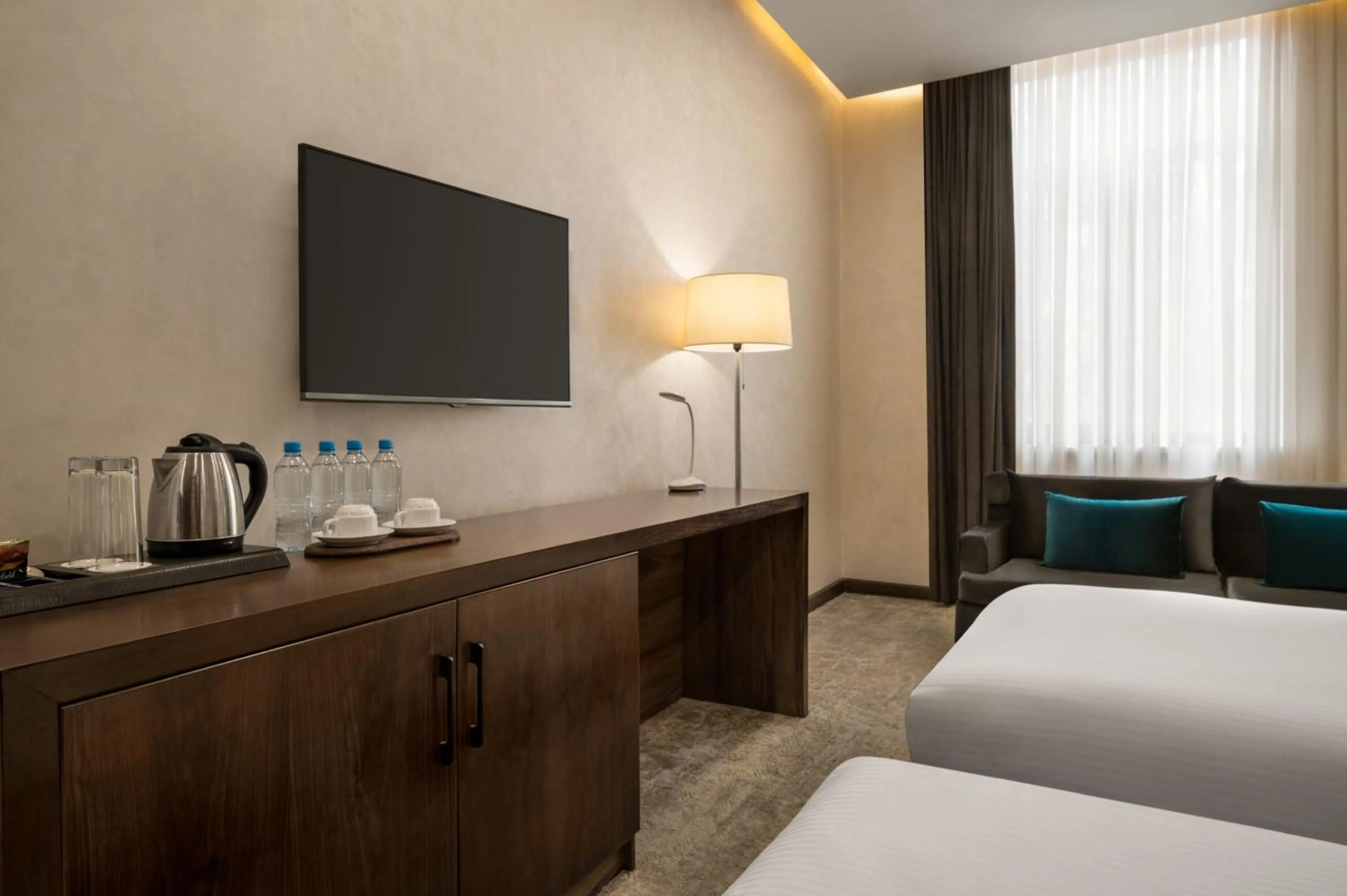 TV and multimedia, TV/Entertainment Center in Regal Stay Hotel by HotelPro Group