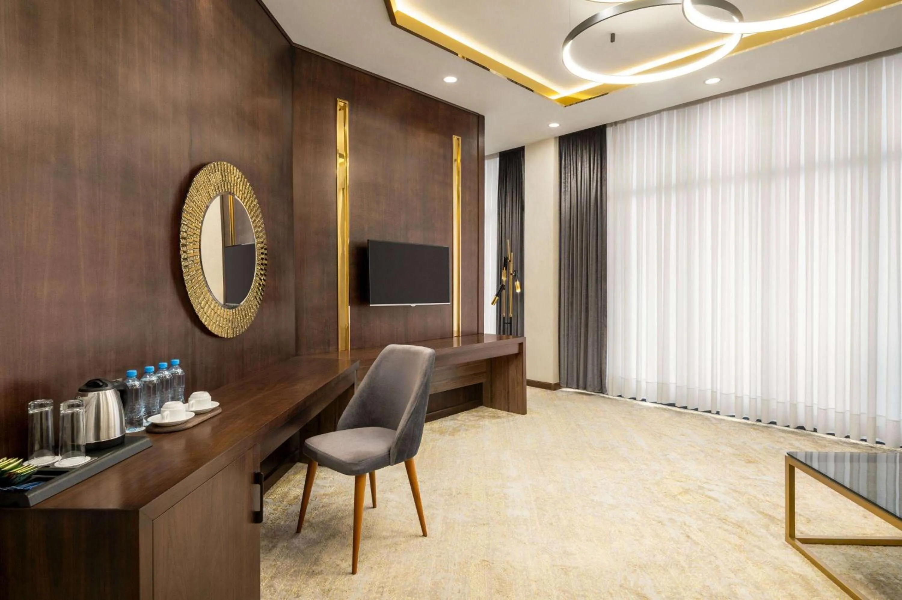 Photo of the whole room, TV/Entertainment Center in Regal Stay Hotel by HotelPro Group