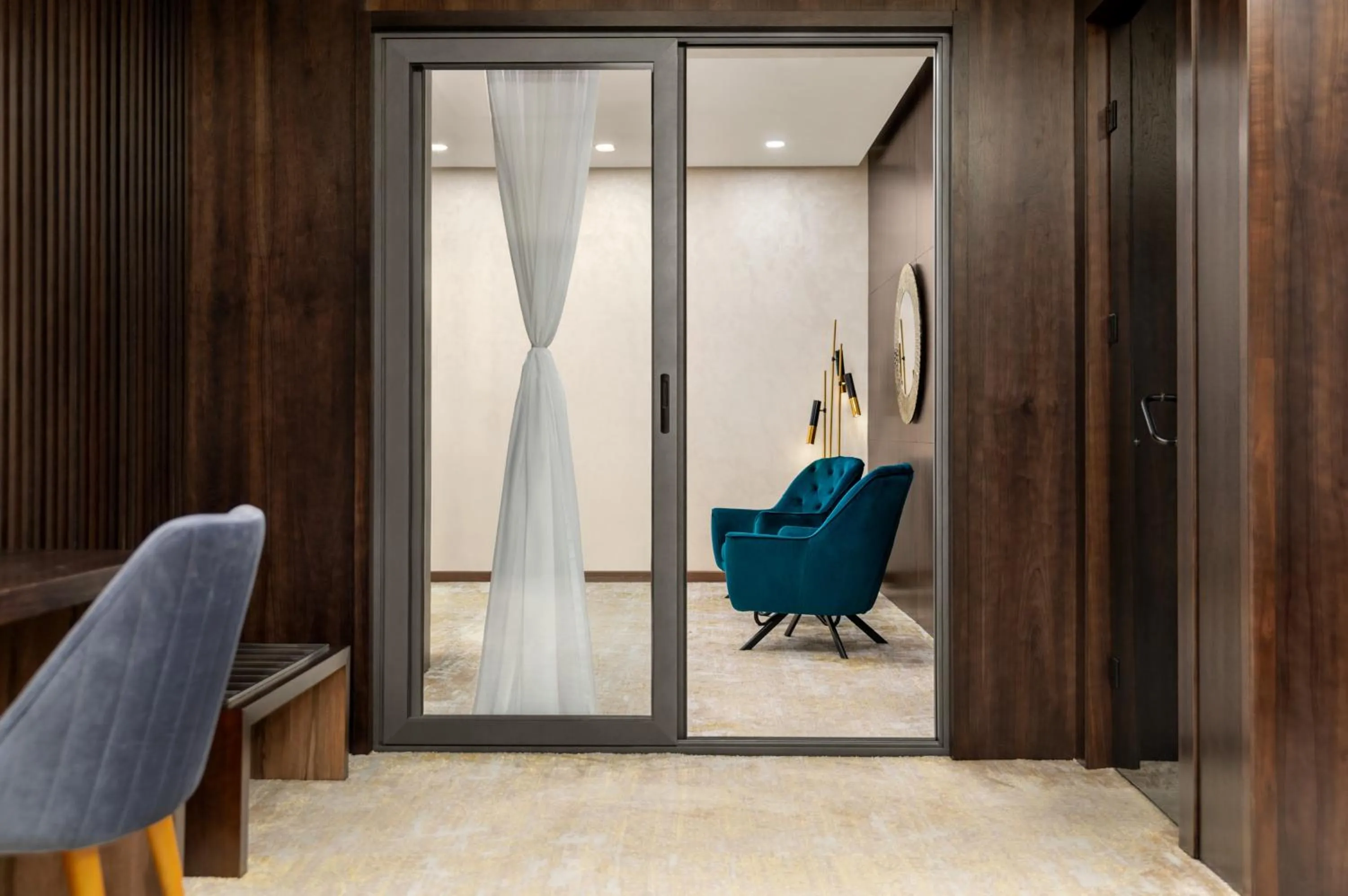 Living room in Regal Stay Hotel by HotelPro Group