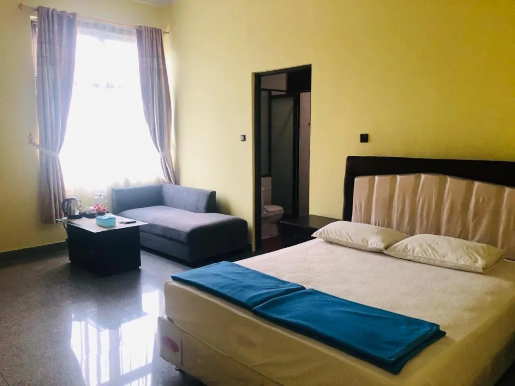 Bed in BRIA Hotel & Convention