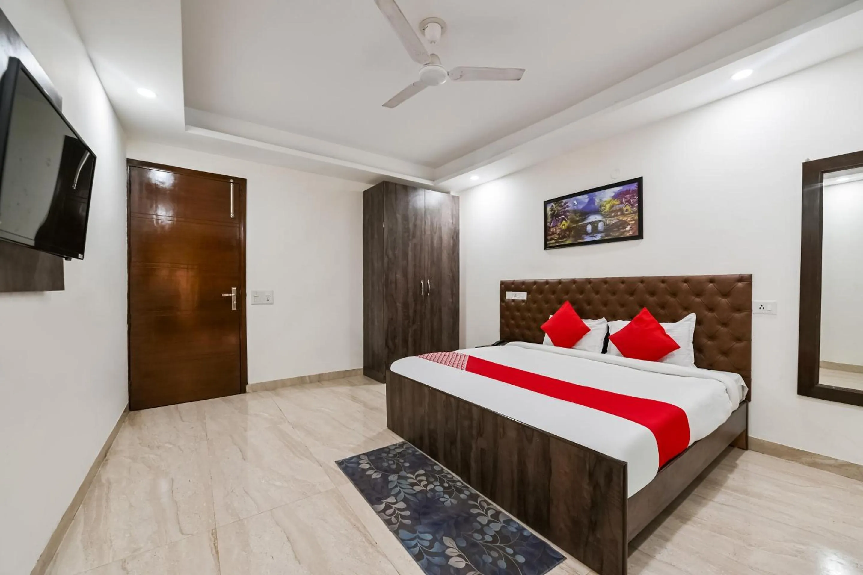 Bedroom in OYO White Rose Wallon Hotel Near Qutab Minar Metro Station