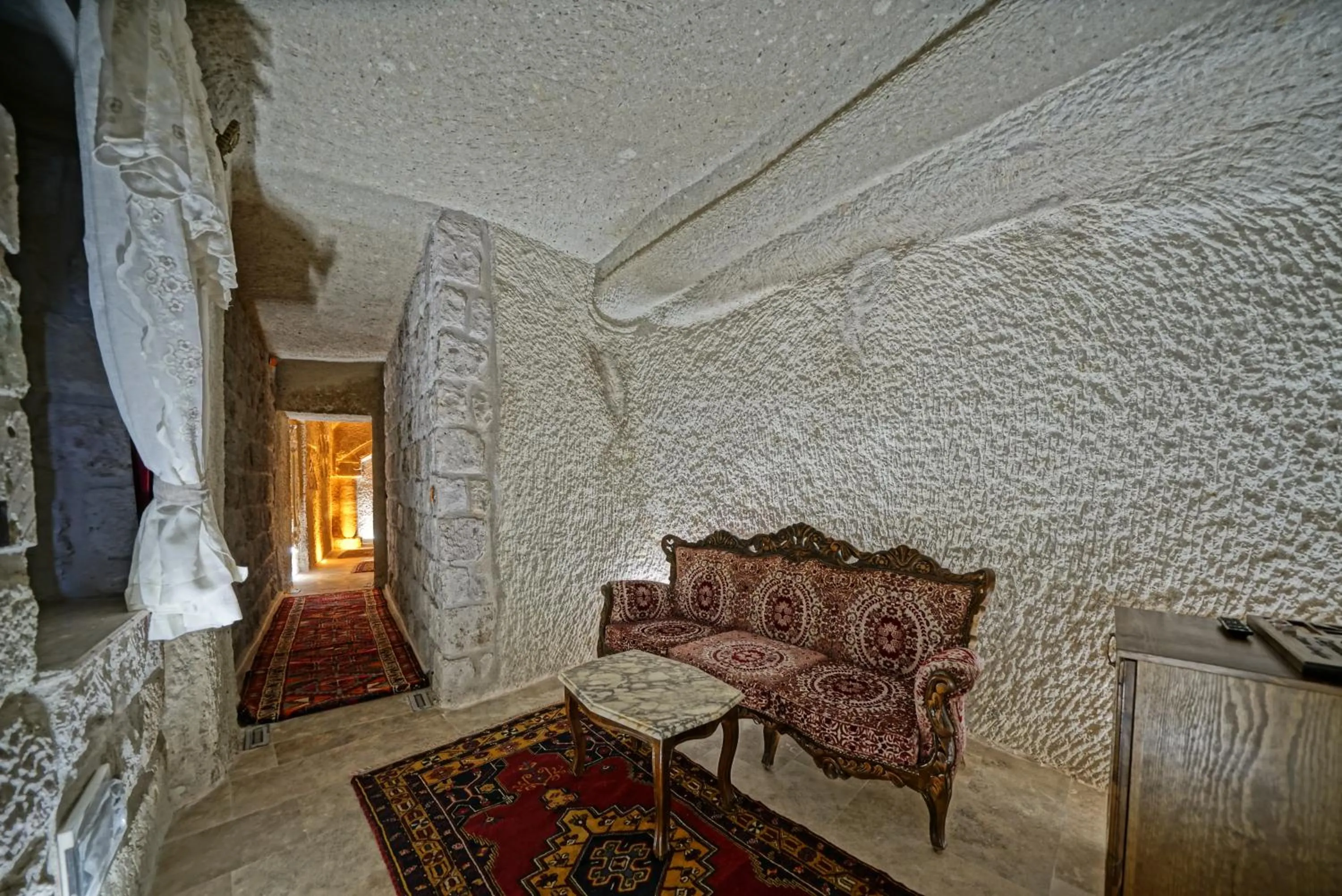 Seating area, Bed in Cappadocia Cave Lodge