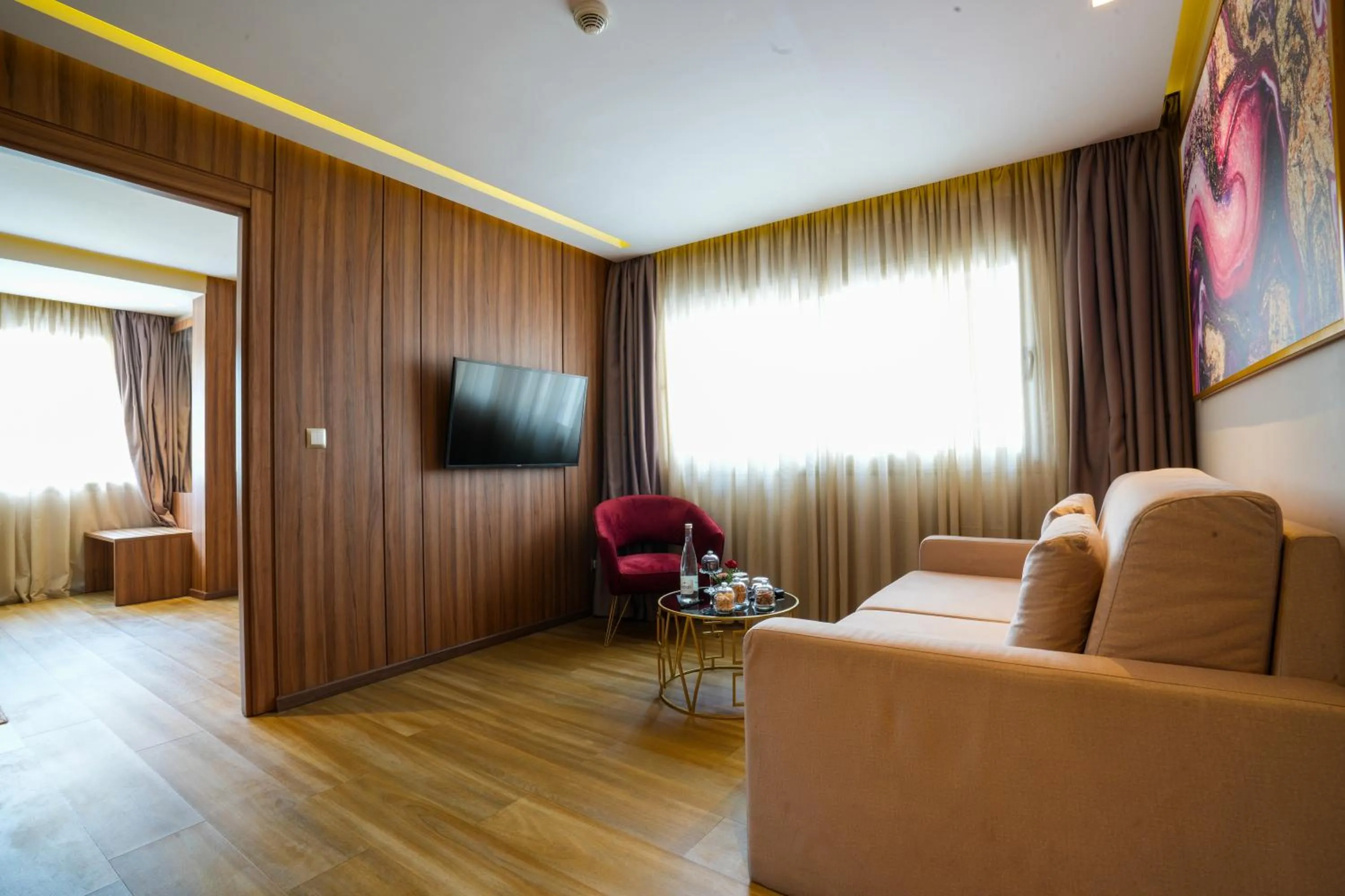 Living room in First Suites Hôtel