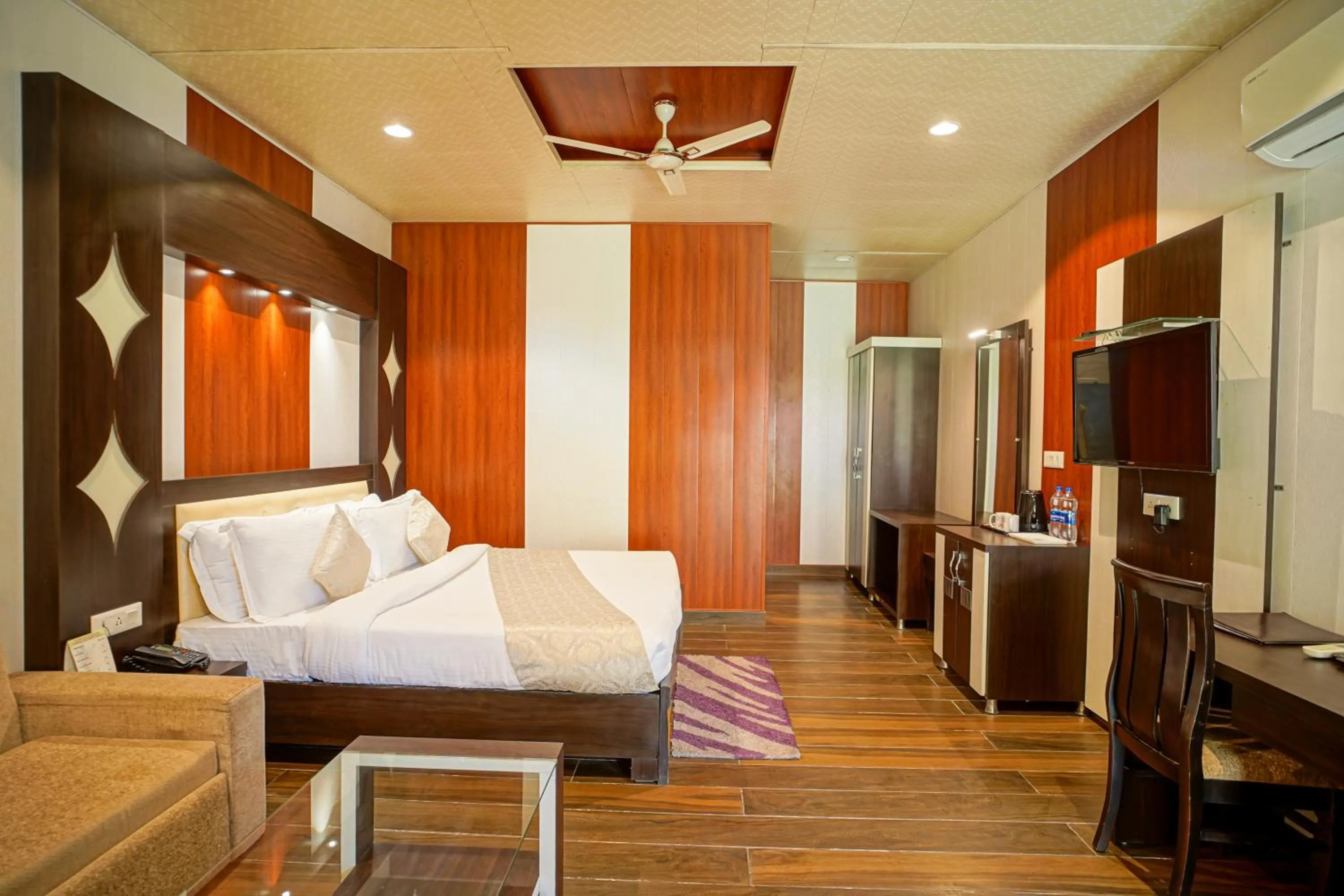 Bed in The Grand Shiva Resort and Spa