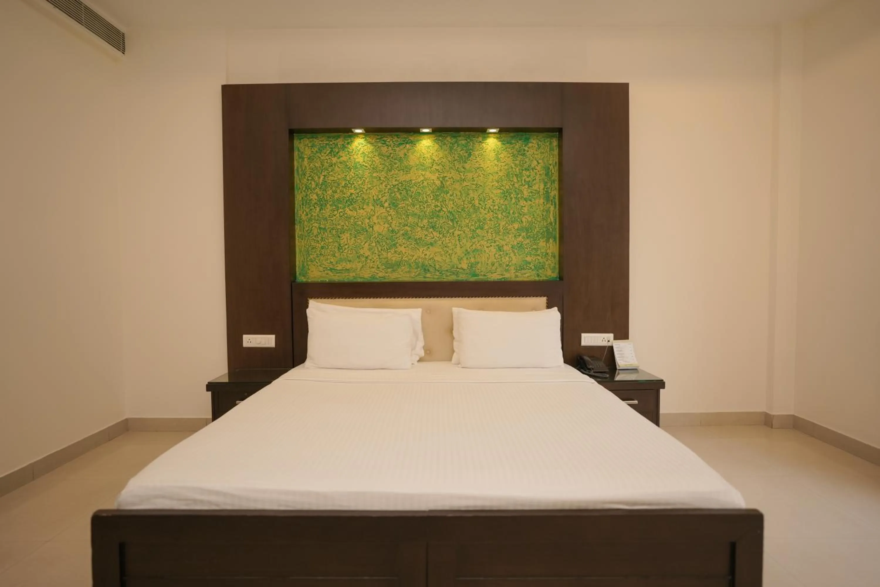 Bed in The Grand Shiva Resort and Spa