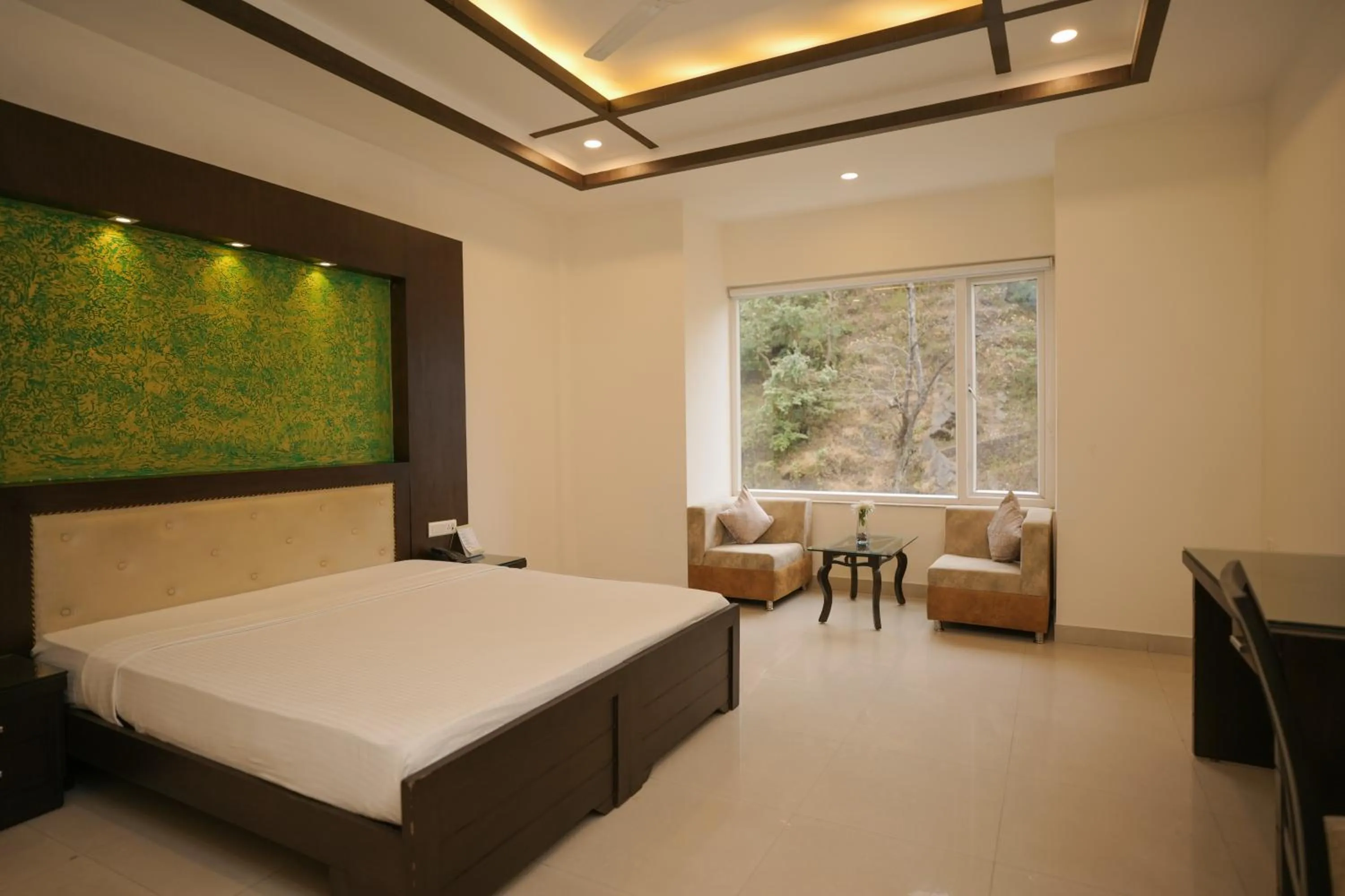 Bed in The Grand Shiva Resort and Spa