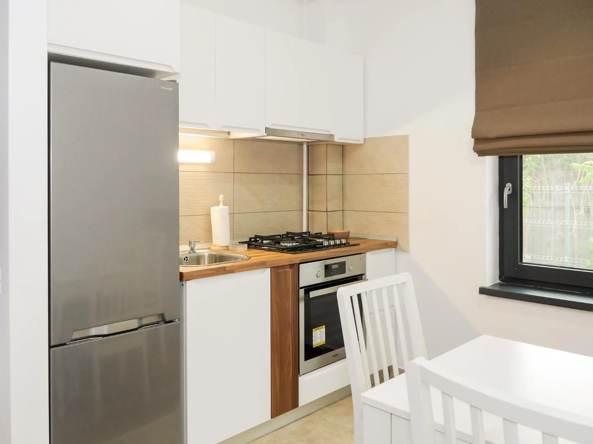Kitchen or kitchenette in Clement Apartments