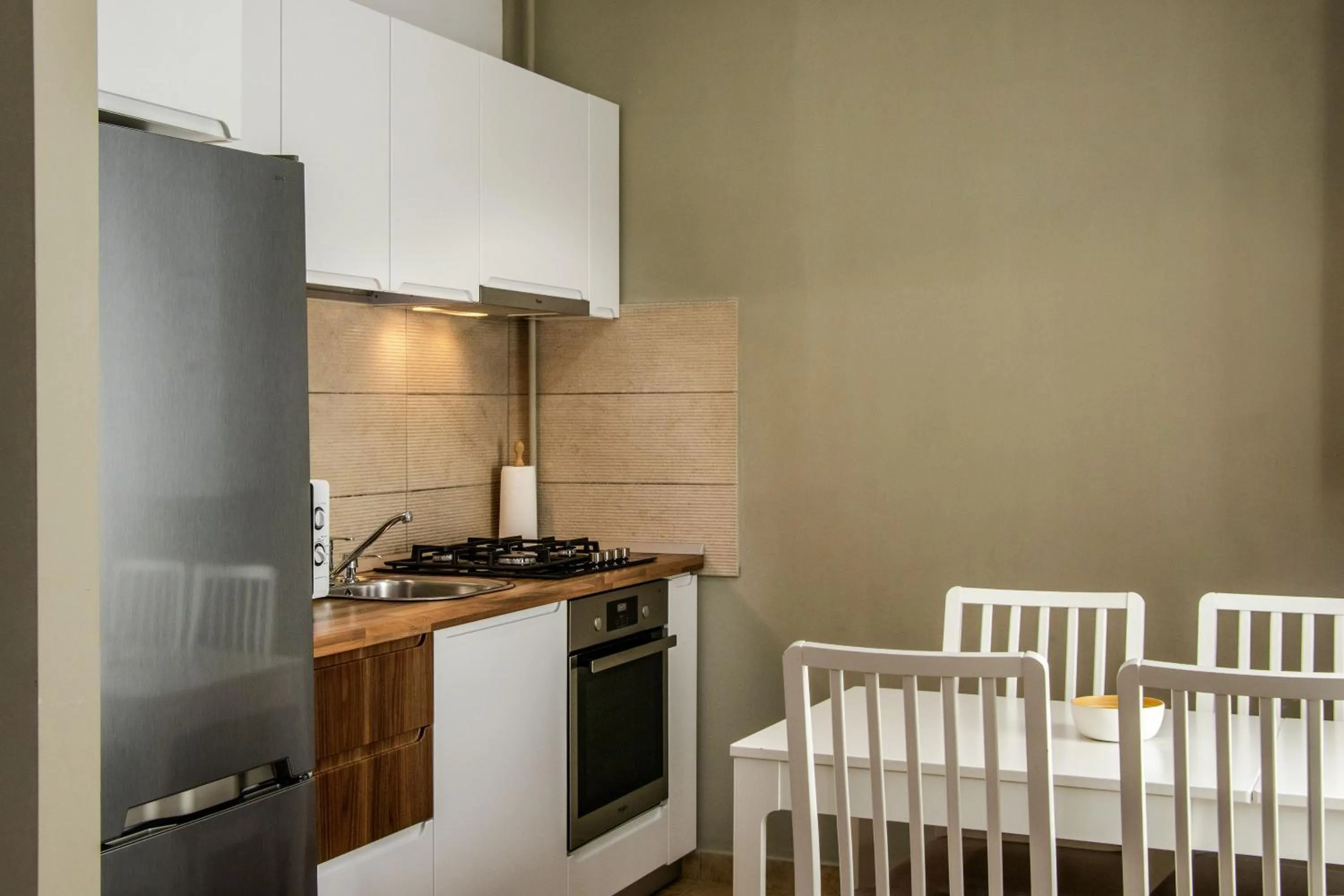 Kitchen or kitchenette in Clement Apartments