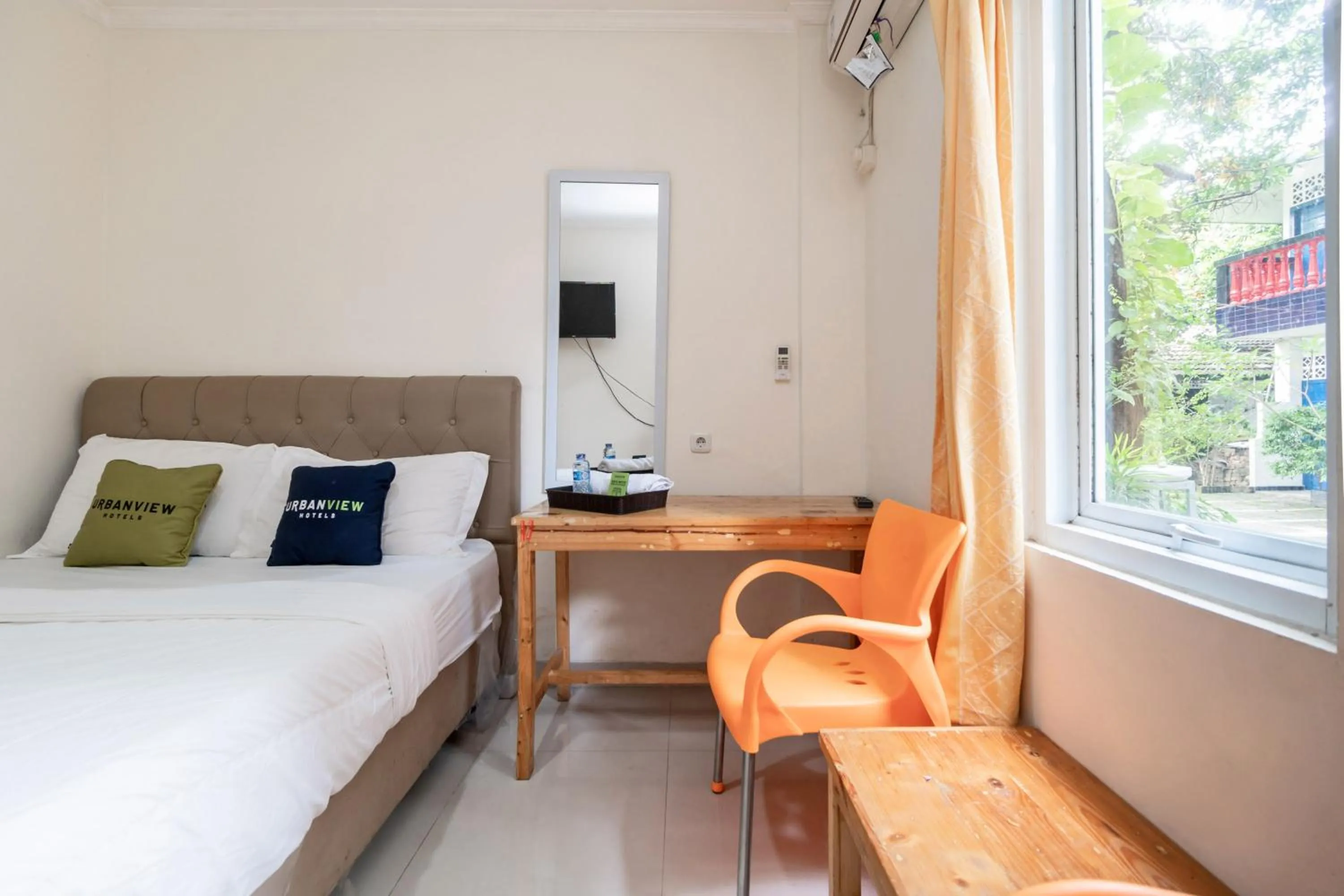 Bed in Urbanview Hotel Minongga Pondok Labu by RedDoorz