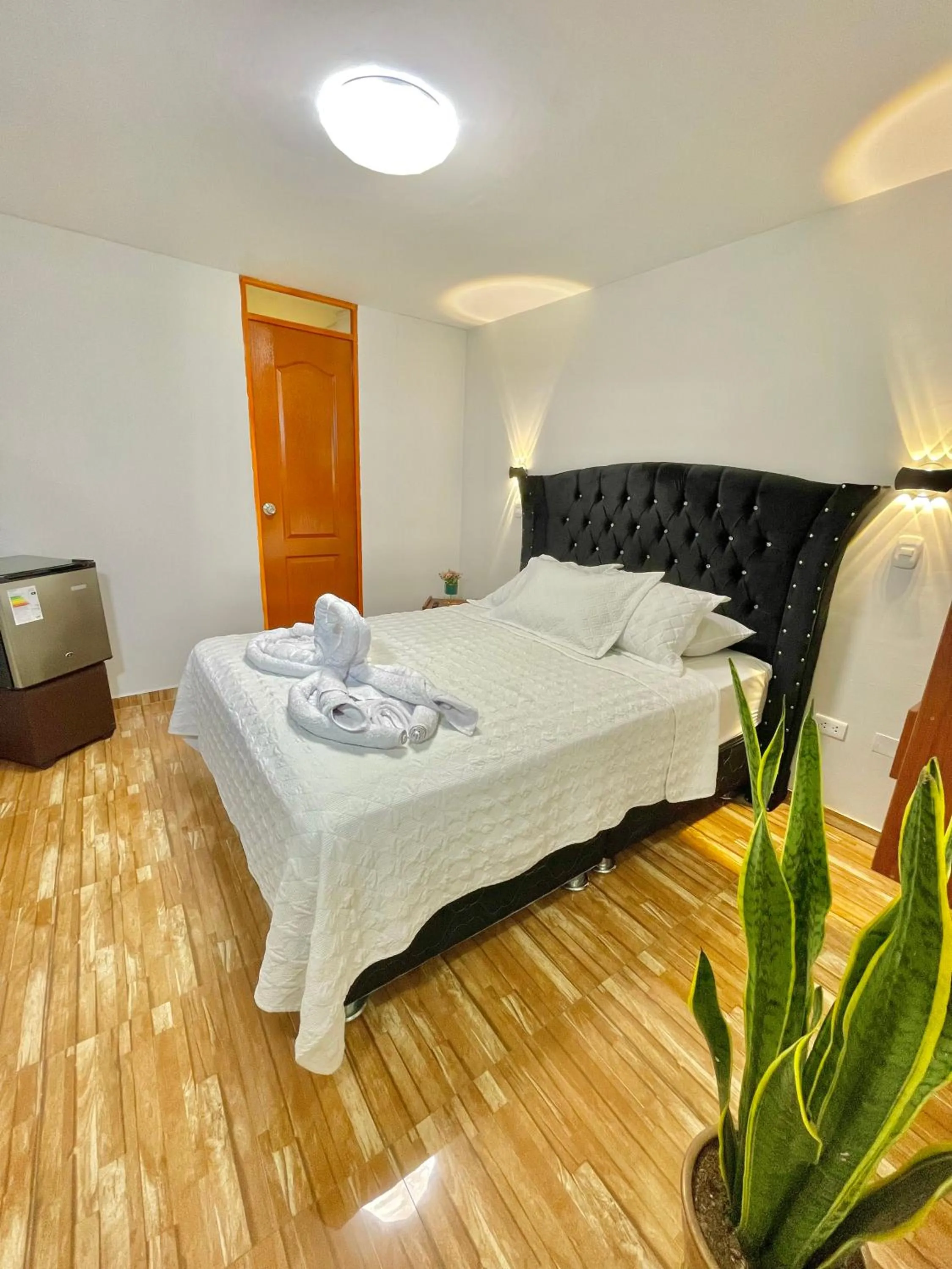 Bed in Jultom Inn Hotel & Suites