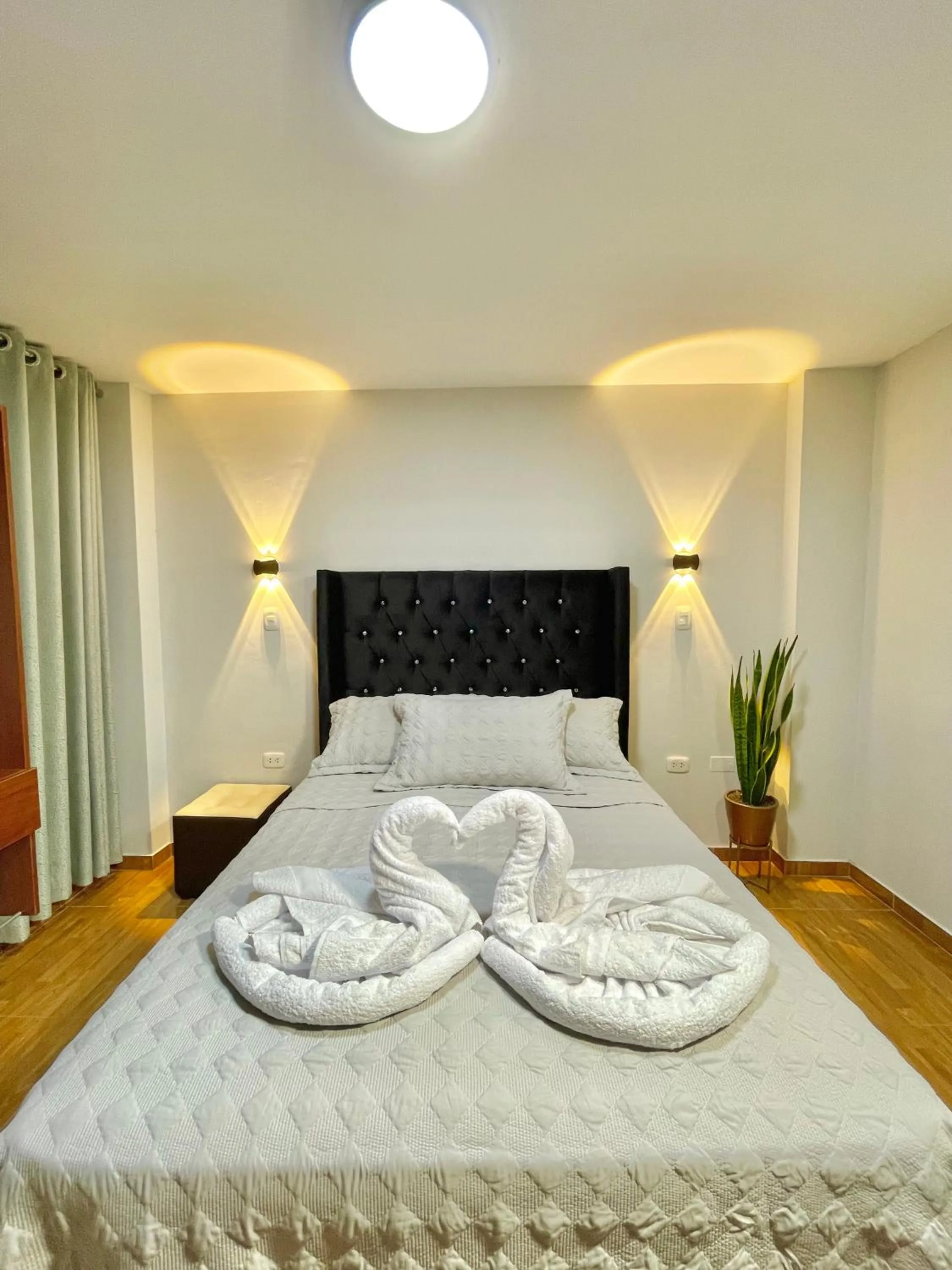 Bed in Jultom Inn Hotel & Suites