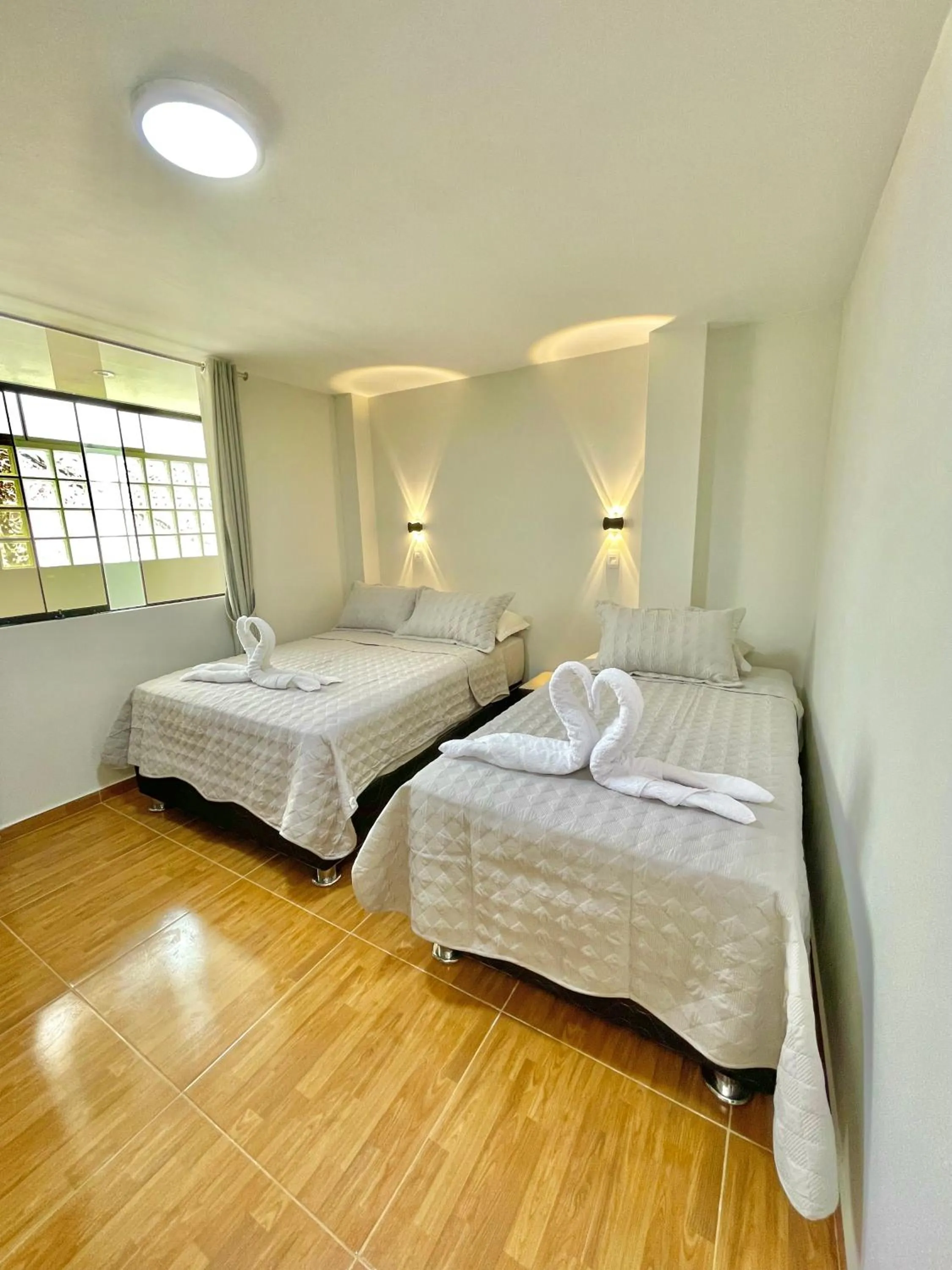 Bed in Jultom Inn Hotel & Suites