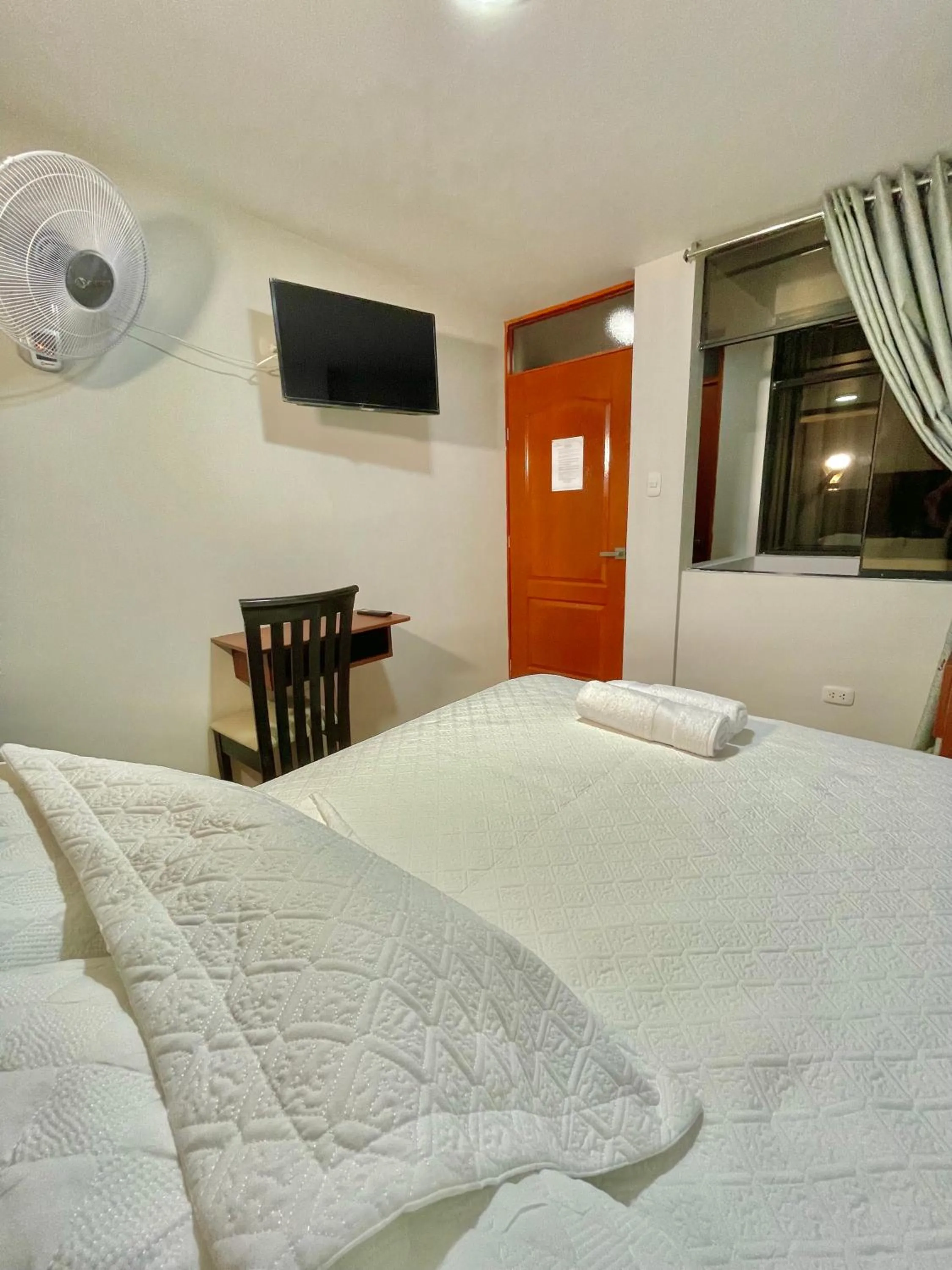 Bed in Jultom Inn Hotel & Suites