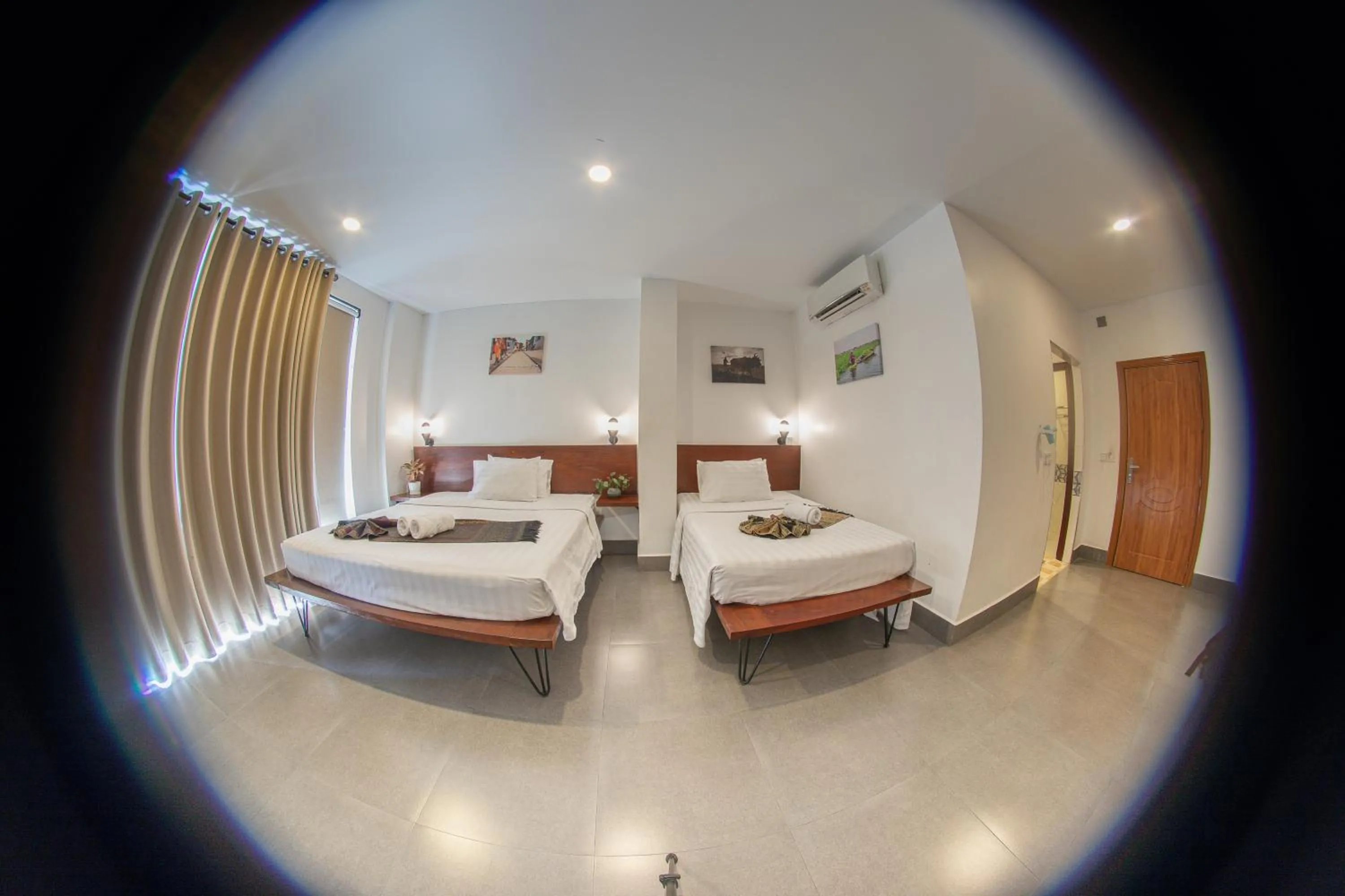 Photo of the whole room, Bed in Pooltop Phnom Penh