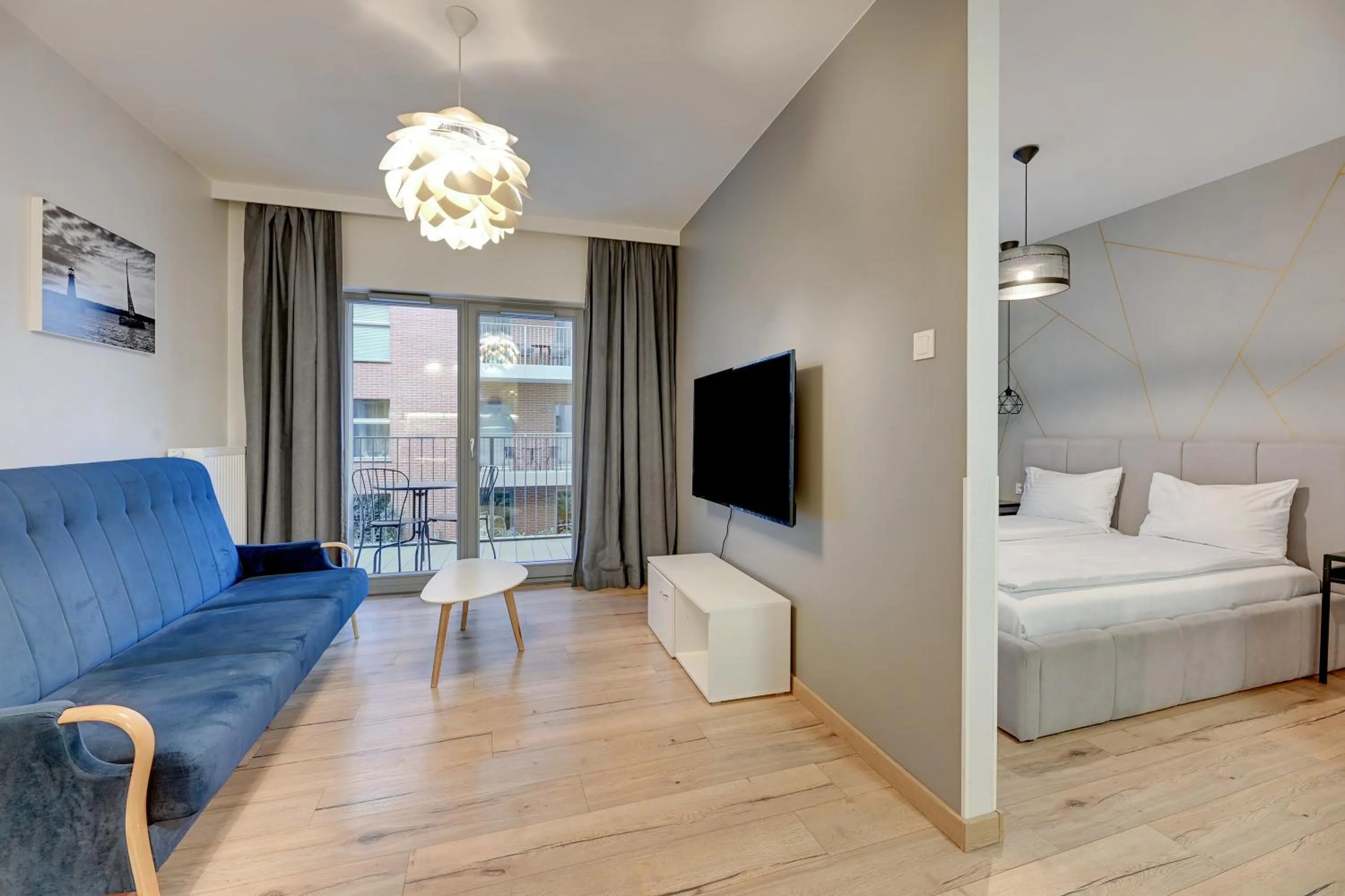 Living room, Bed in GRANO APARTMENTS Gdańsk Residence SPA & Wellness - GRANO APARTMENTS Gdańsk Old Town SPA & Wellness