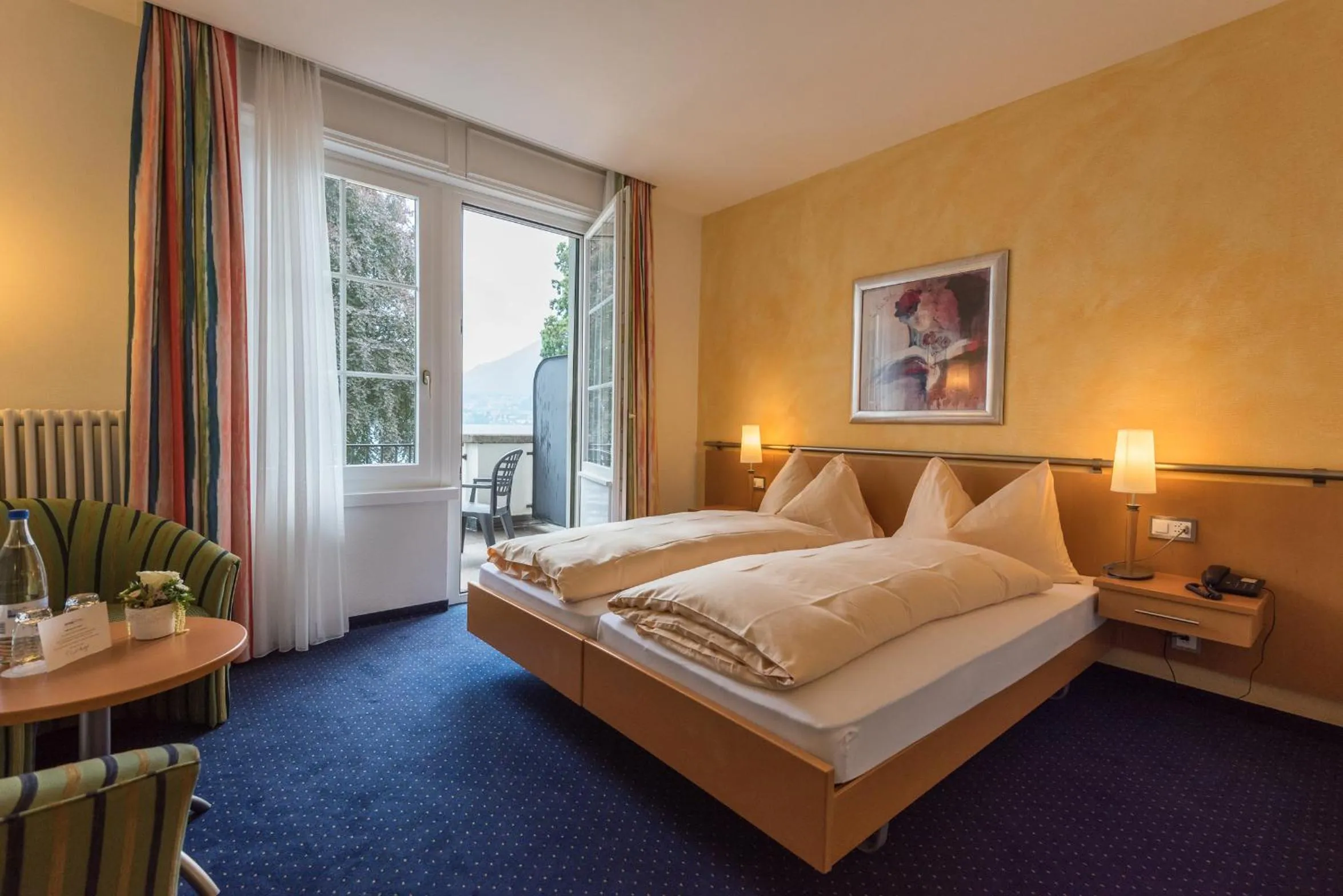 Balcony/Terrace, Bed in Parkhotel Gunten – Beach & Spa