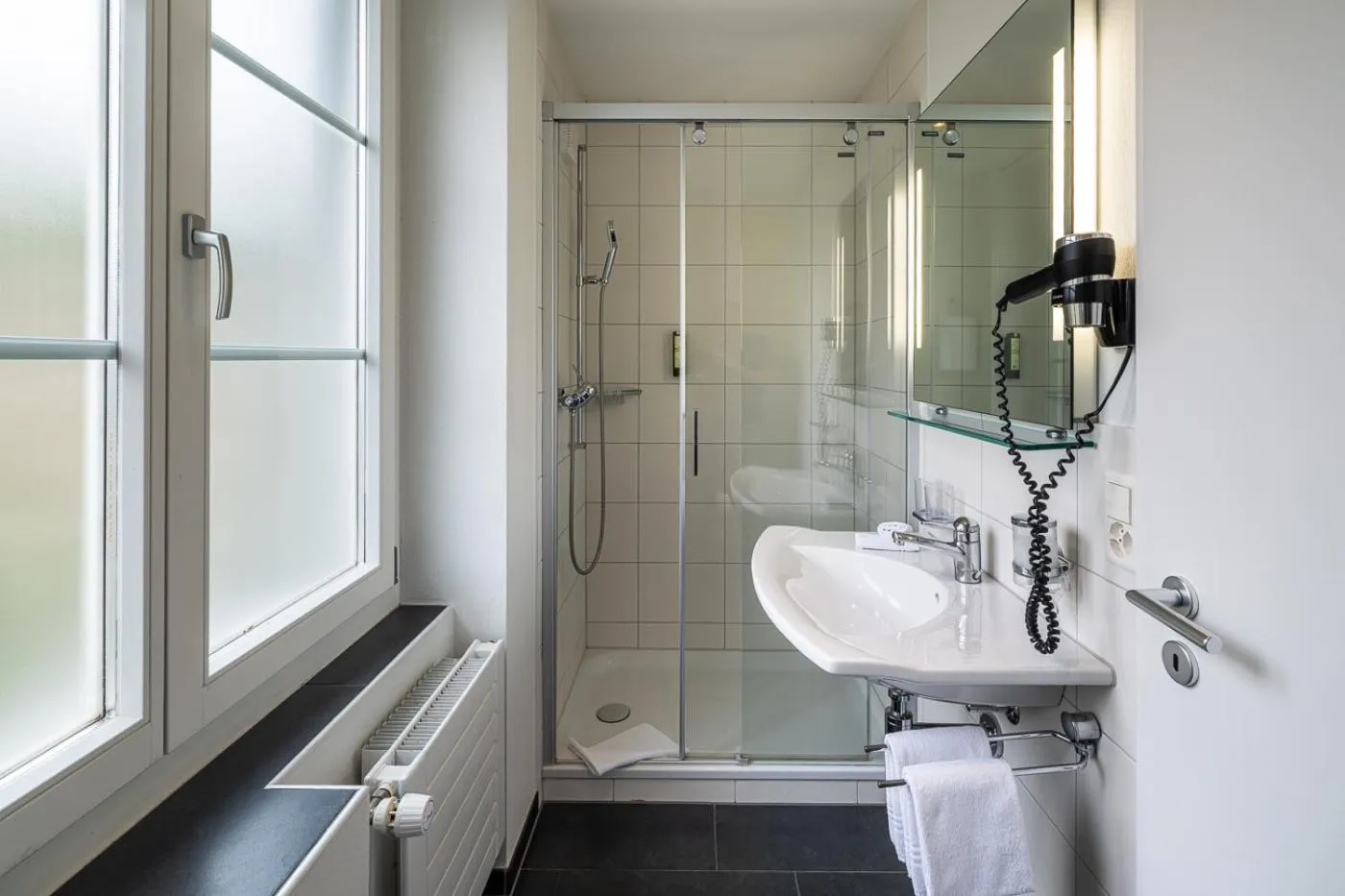 Bathroom in Parkhotel Gunten – Beach & Spa