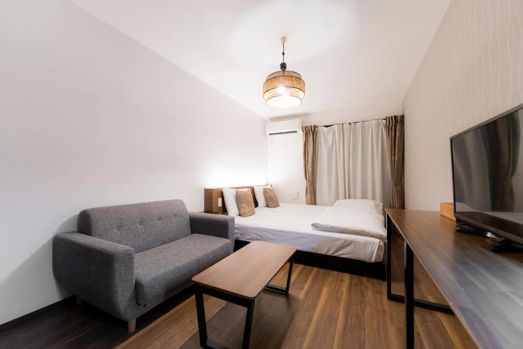 Bed in Apartment Hotel KANSO