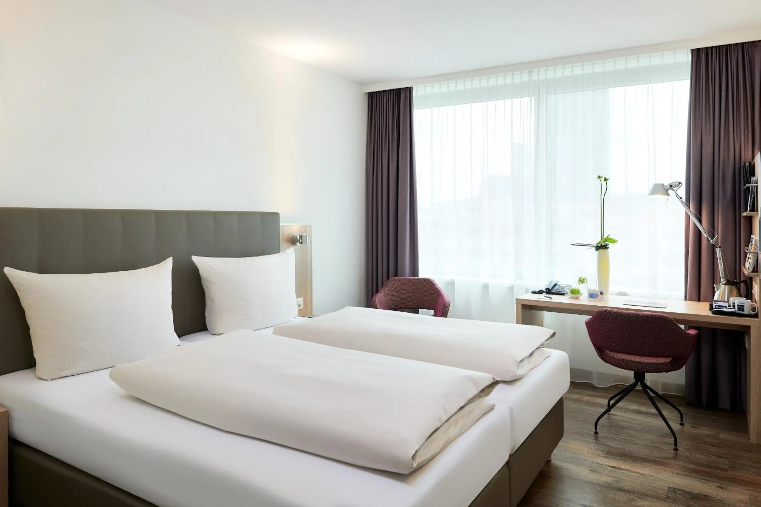 Photo of the whole room, Bed in Essential by Dorint Basel City