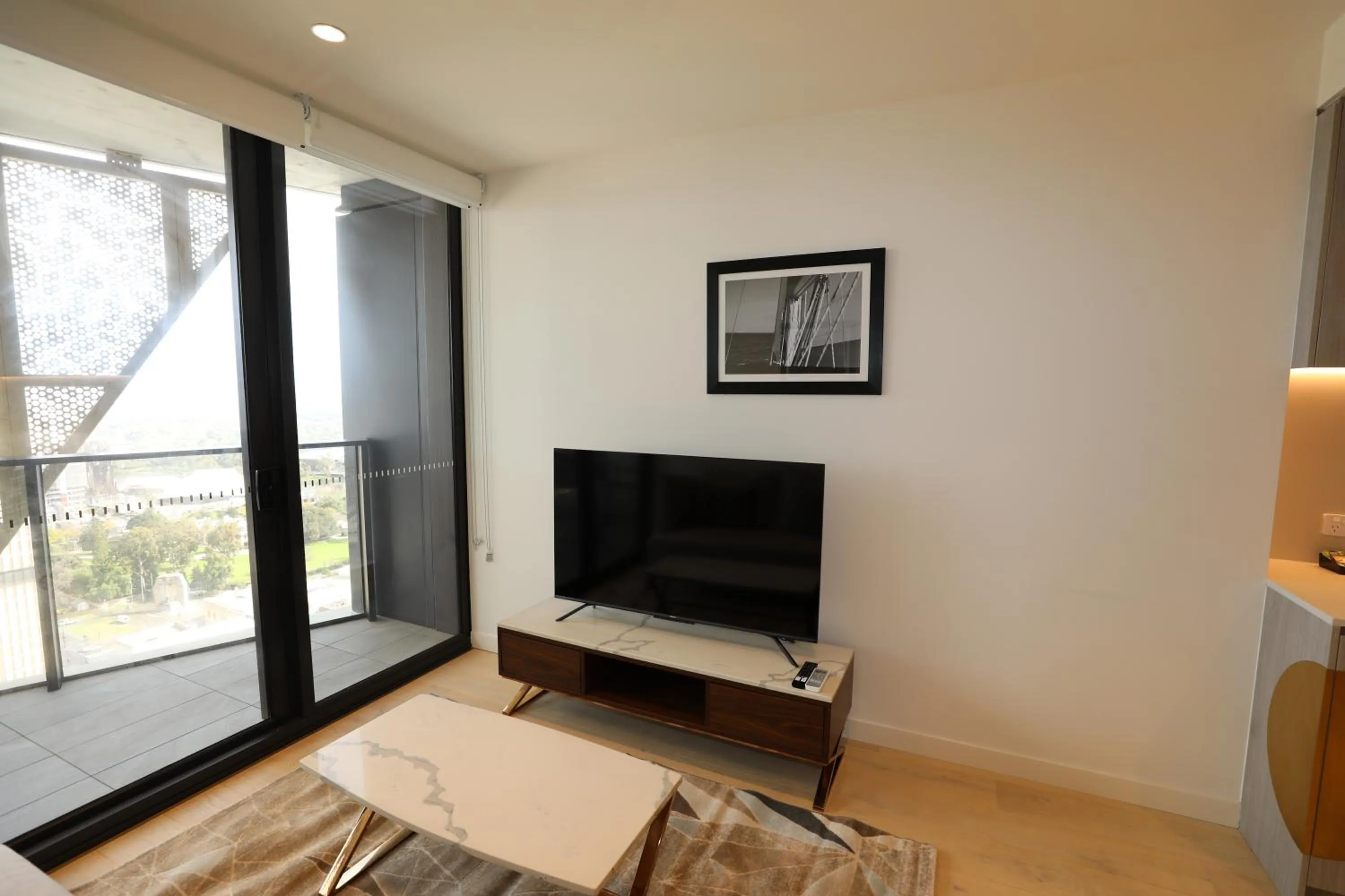 TV and multimedia in Realm Apartments by CLLIX