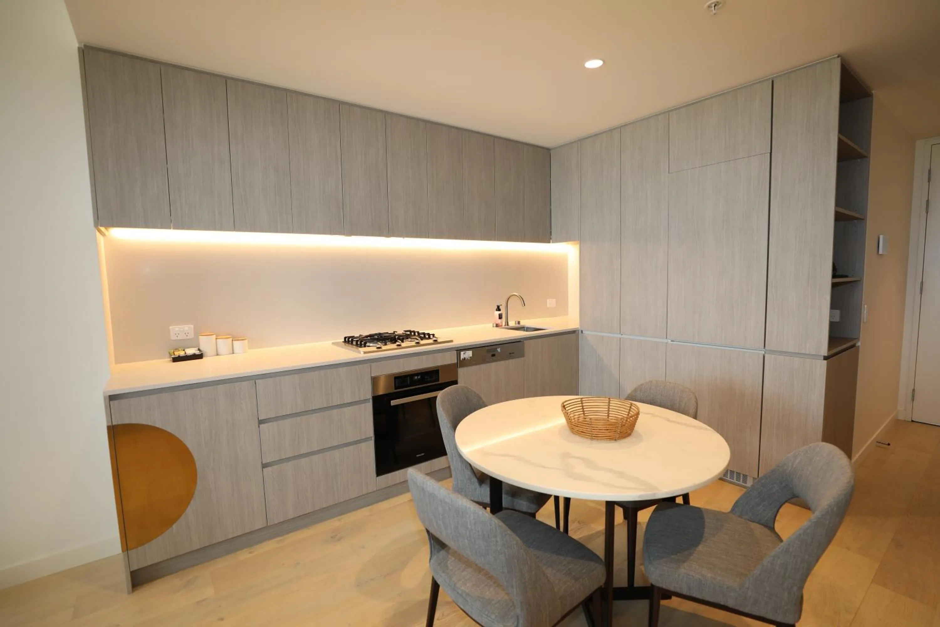 Dining area in Realm Apartments by CLLIX