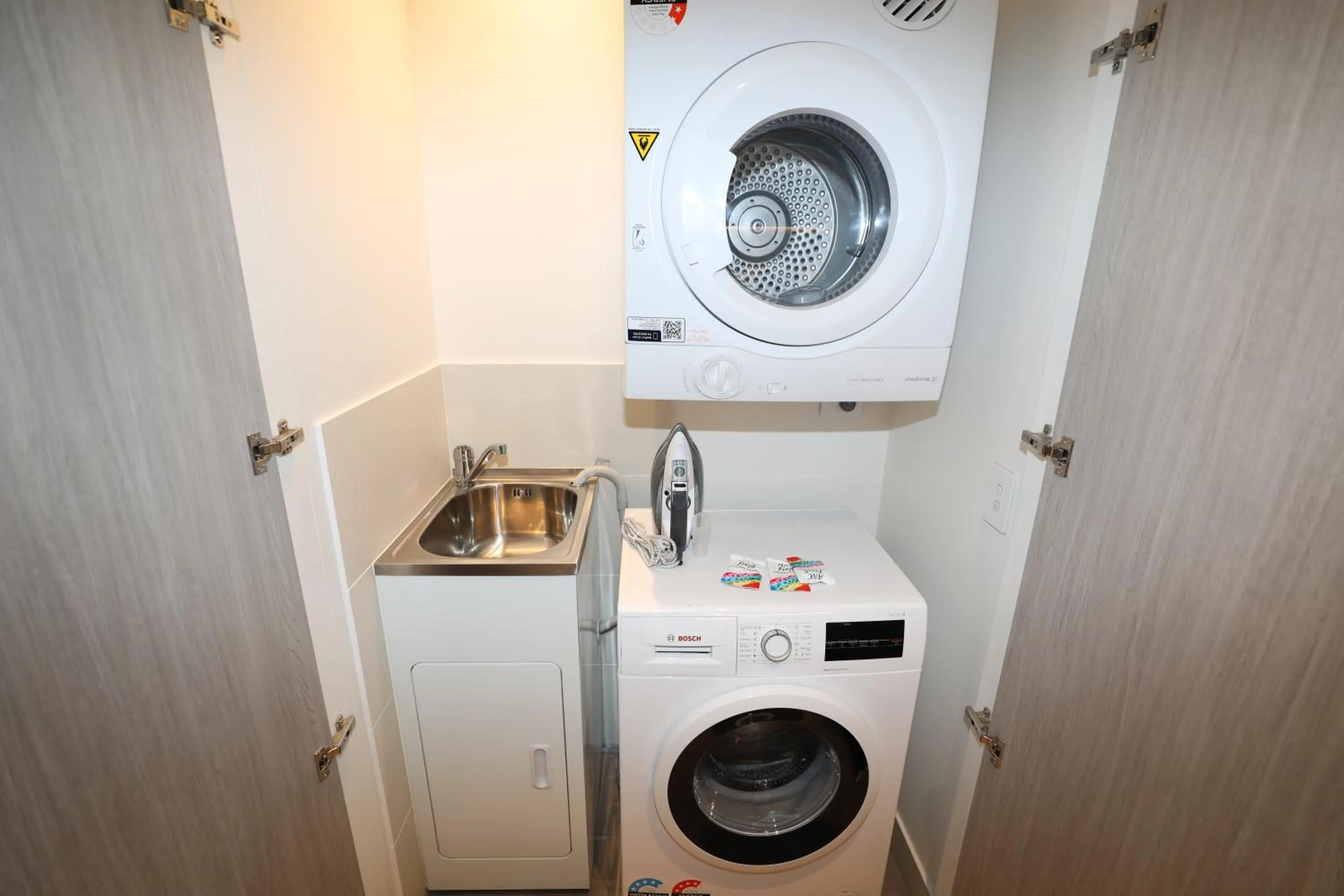 laundry in Realm Apartments by CLLIX