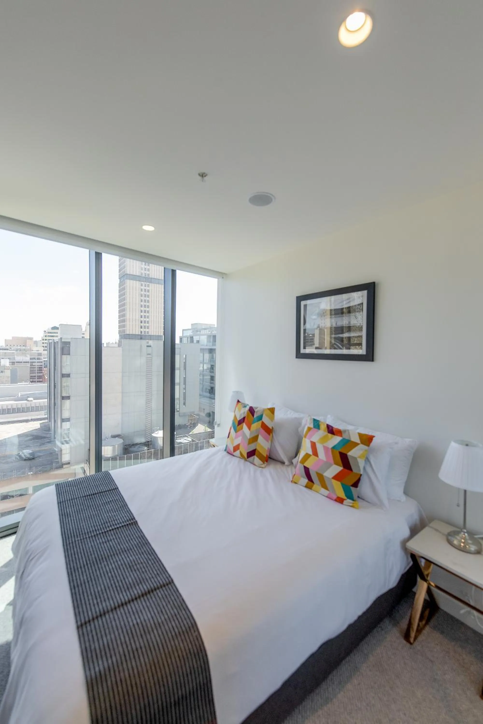 Bed in Realm Apartments by CLLIX