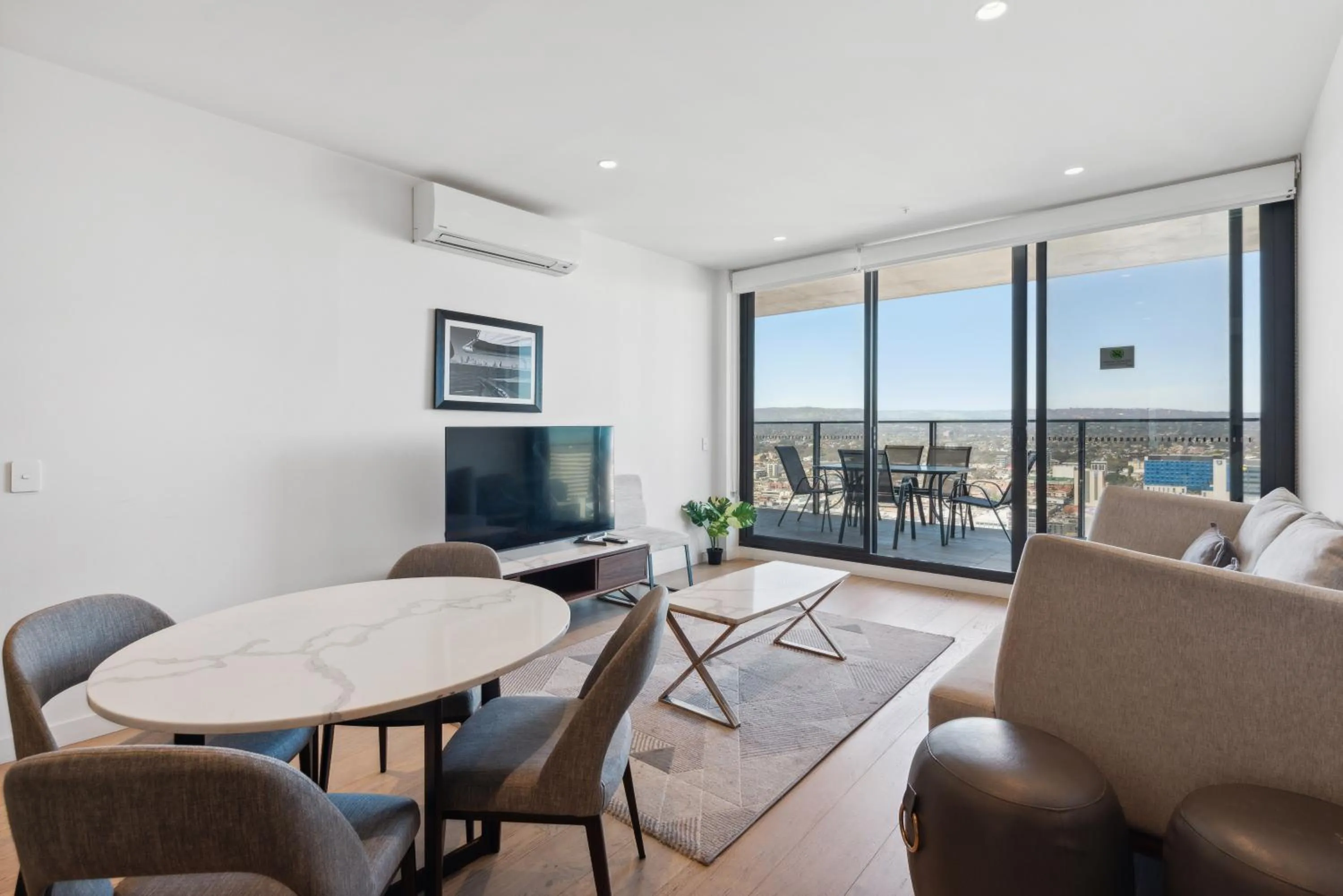 Living room in Realm Apartments by CLLIX