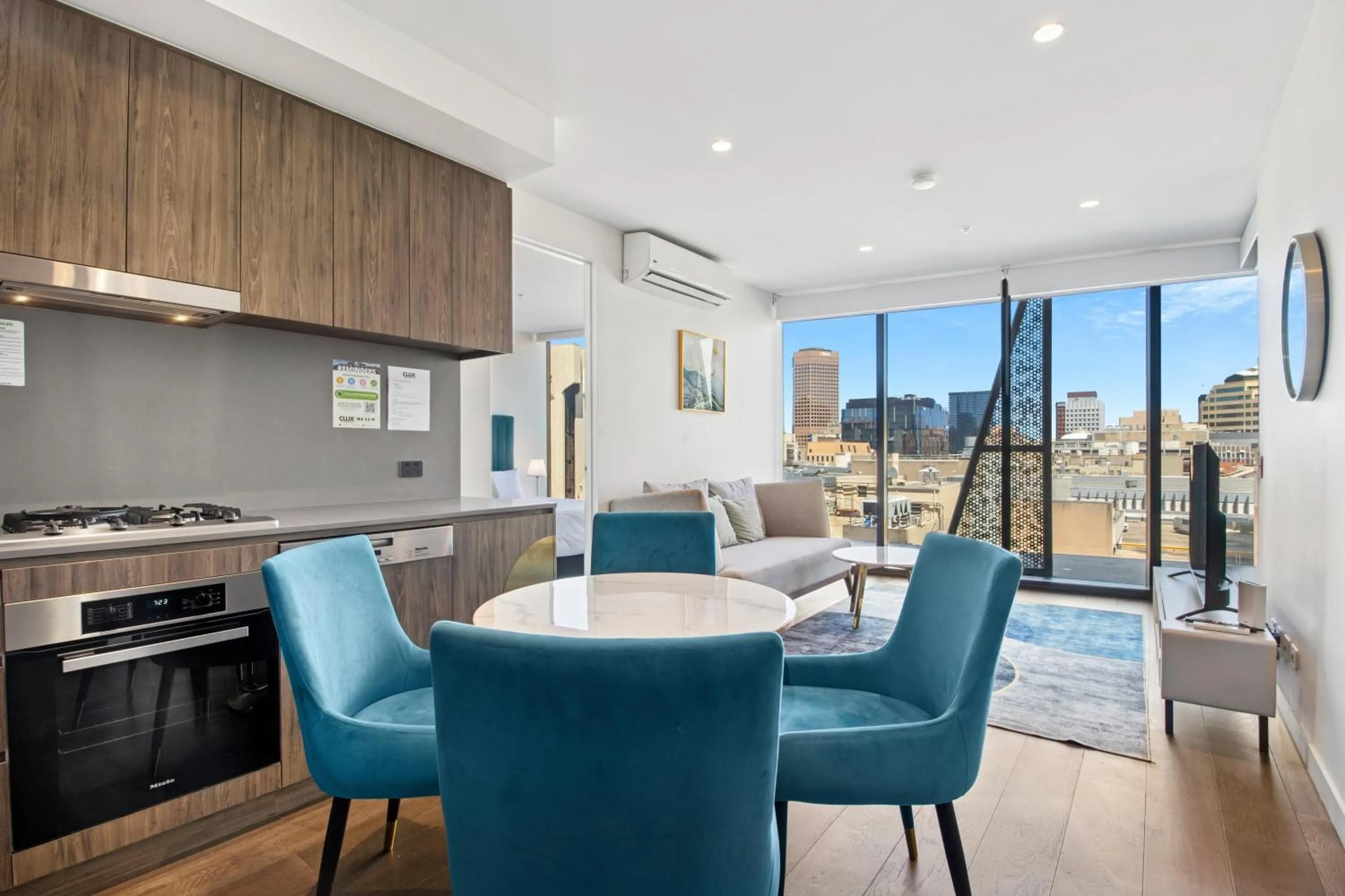 Dining area in Realm Apartments by CLLIX