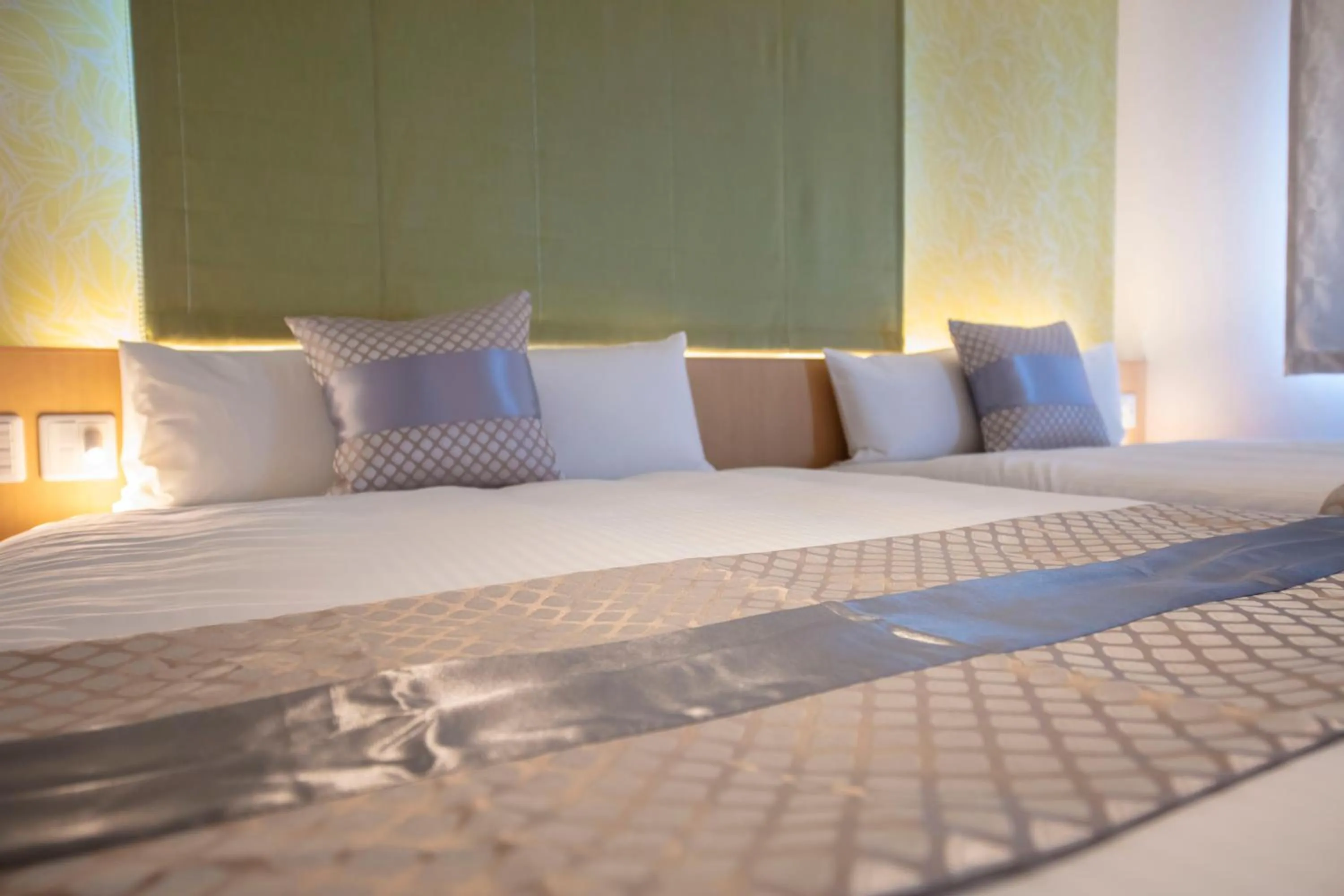 Bed in GRAND BASE Okayama Ekimae